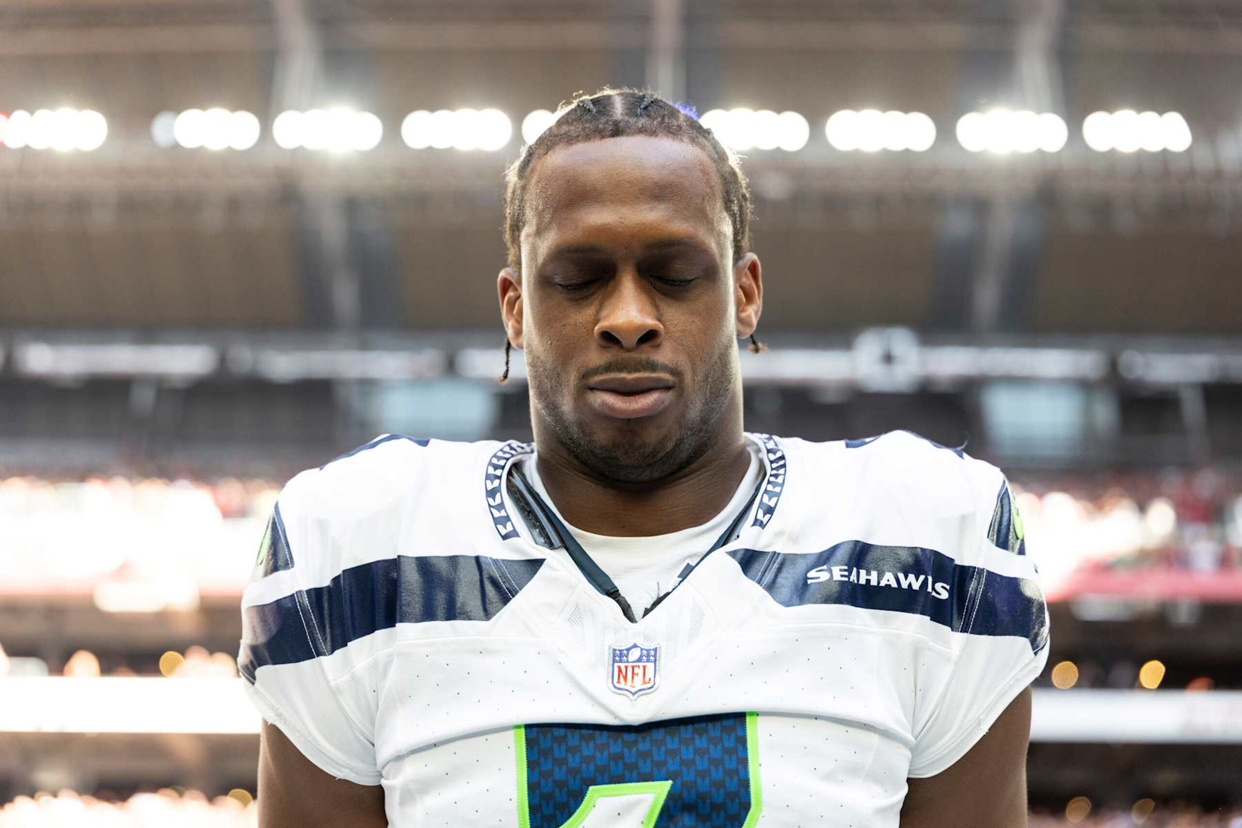 GLENDALE, ARIZONA - DECEMBER 8: Geno Smith #7 of the Seattle Seahawks looks on during the national anthem prior to an NFL Football game against the Arizona Cardinals at State Farm Stadium on December 08, 2024 in Glendale, Arizona. (Photo by Michael Owens/Getty Images)