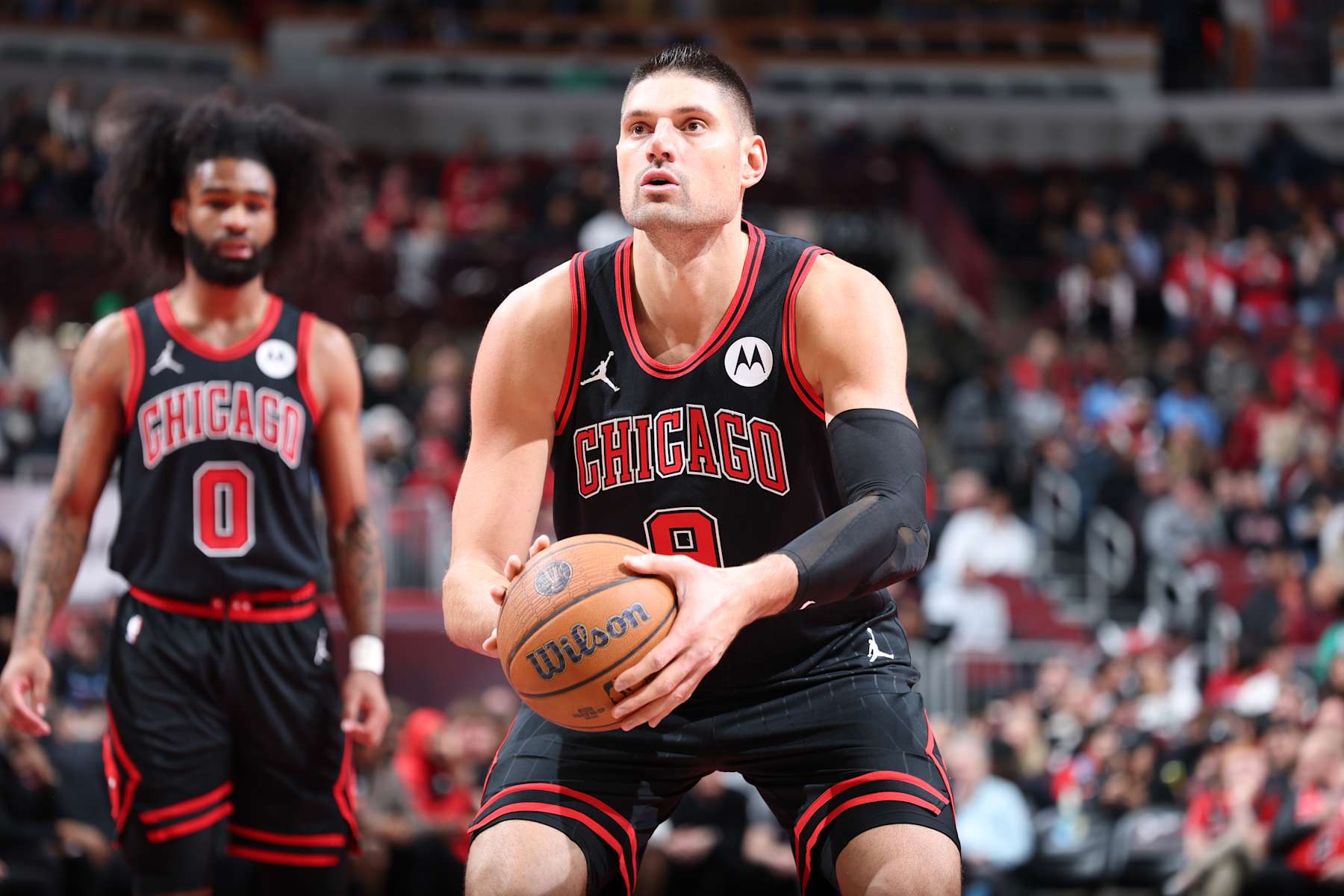 CHICAGO, IL - NOVEMBER 29: Nikola Vucevic #9 of the Chicago Bulls shoots a free throw during the game against the Boston Celtics during the Emirates NBA Cup game on November 29, 2024 at United Center in Chicago, Illinois. NOTE TO USER: User expressly acknowledges and agrees that, by downloading and or using this photograph, User is consenting to the terms and conditions of the Getty Images License Agreement. Mandatory Copyright Notice: Copyright 2024 NBAE (Photo by Jeff Haynes/NBAE via Getty Images)