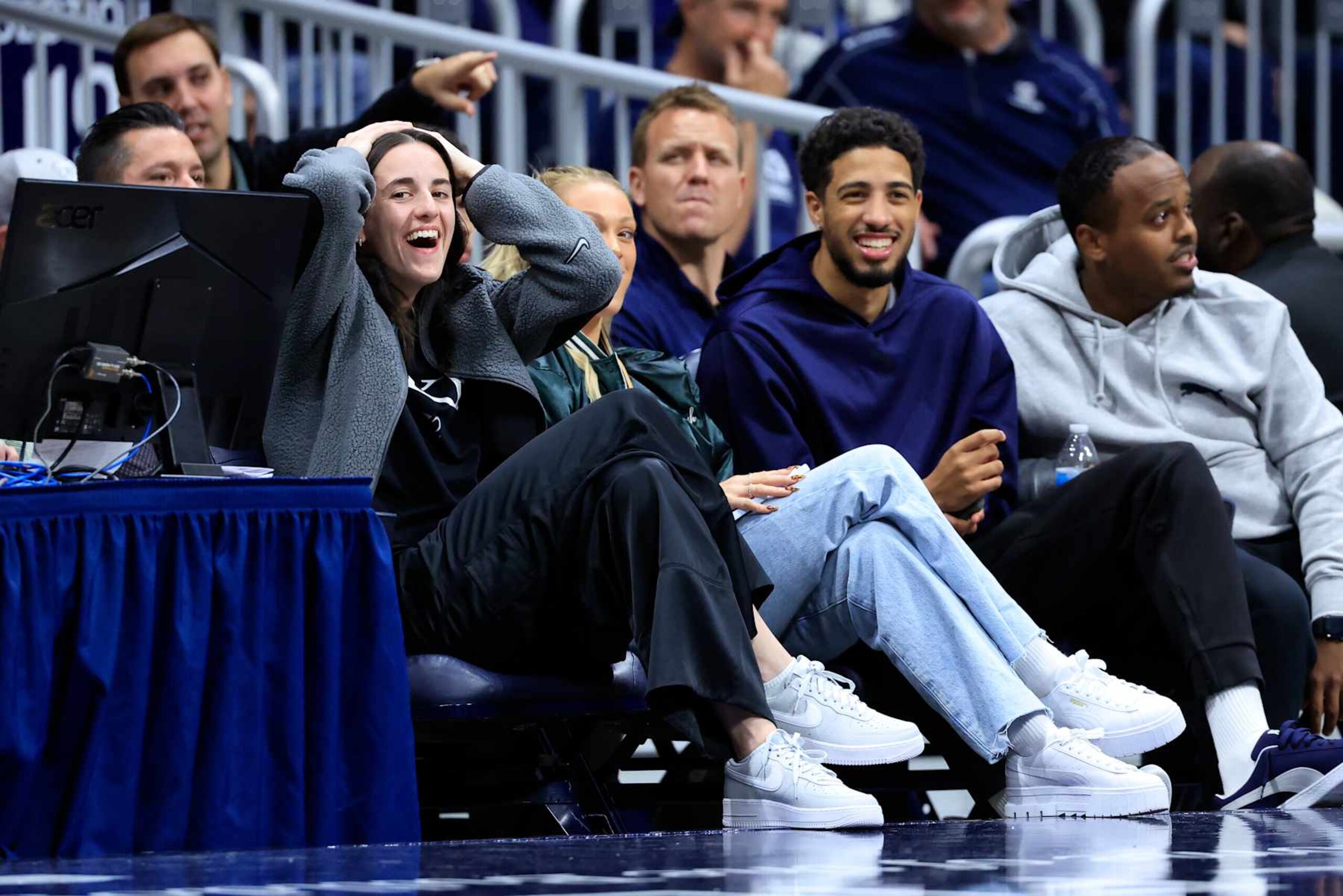 INDIANAPOLIS, INDIANA - NOVEMBER 11: Caitlin Clark (L) of the Indiana Fever and Tyrese Haliburton (2nd R) of the Indiana Pacers react in a game between the Western Michigan Broncos and the Butler Bulldogs at Hinkle Fieldhouse on November 11, 2024 in Indianapolis, Indiana. (Photo by Justin Casterline/Getty Images)