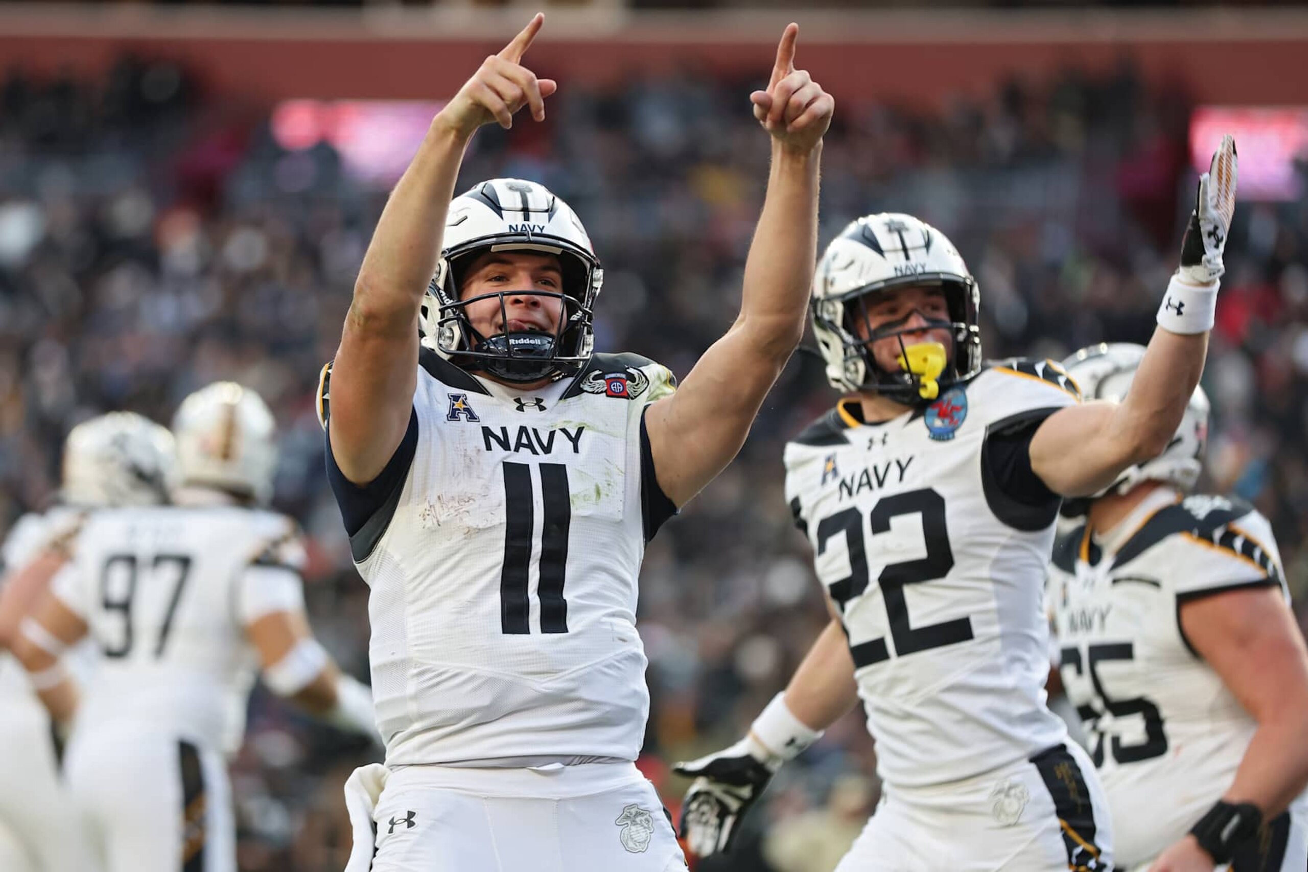 LANDOVER, MARYLAND - DECEMBER 14: Quarterback Blake Horvath #11 of the Navy Midshipmen celebrates after scoring a touchdown against the Army Black Knights during the first quarter of 125th America's Game between the Army Black Knights and the Navy Midshipmen at Northwest Stadium on December 14, 2024 in Landover, Maryland.  (Photo by Patrick Smith/Getty Images)