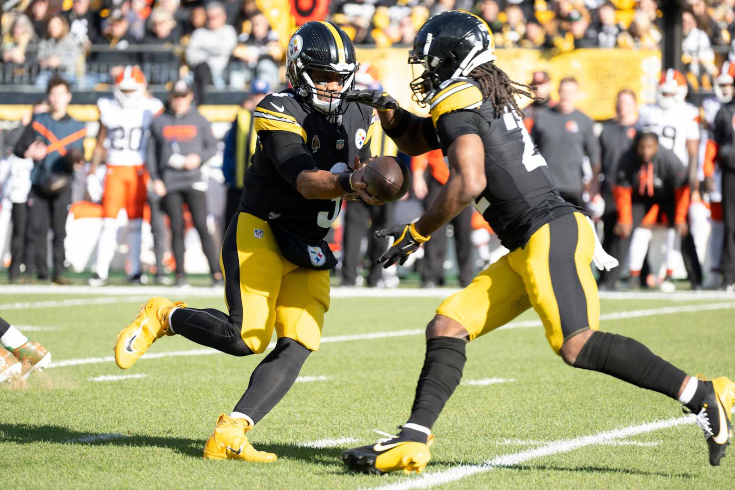 PITTSBURGH, PA - DECEMBER 08:   Pittsburgh Steelers quarterback Russell Wilson (3) hands the ball to running back Najee Harris (22)during the game between the Pittsburgh Steelers and the Cleveland Browns at Acrisure Stadium on December 8, 2024 in Pittsburgh, PA. (Photo by Shelley Lipton/Icon Sportswire via Getty Images)