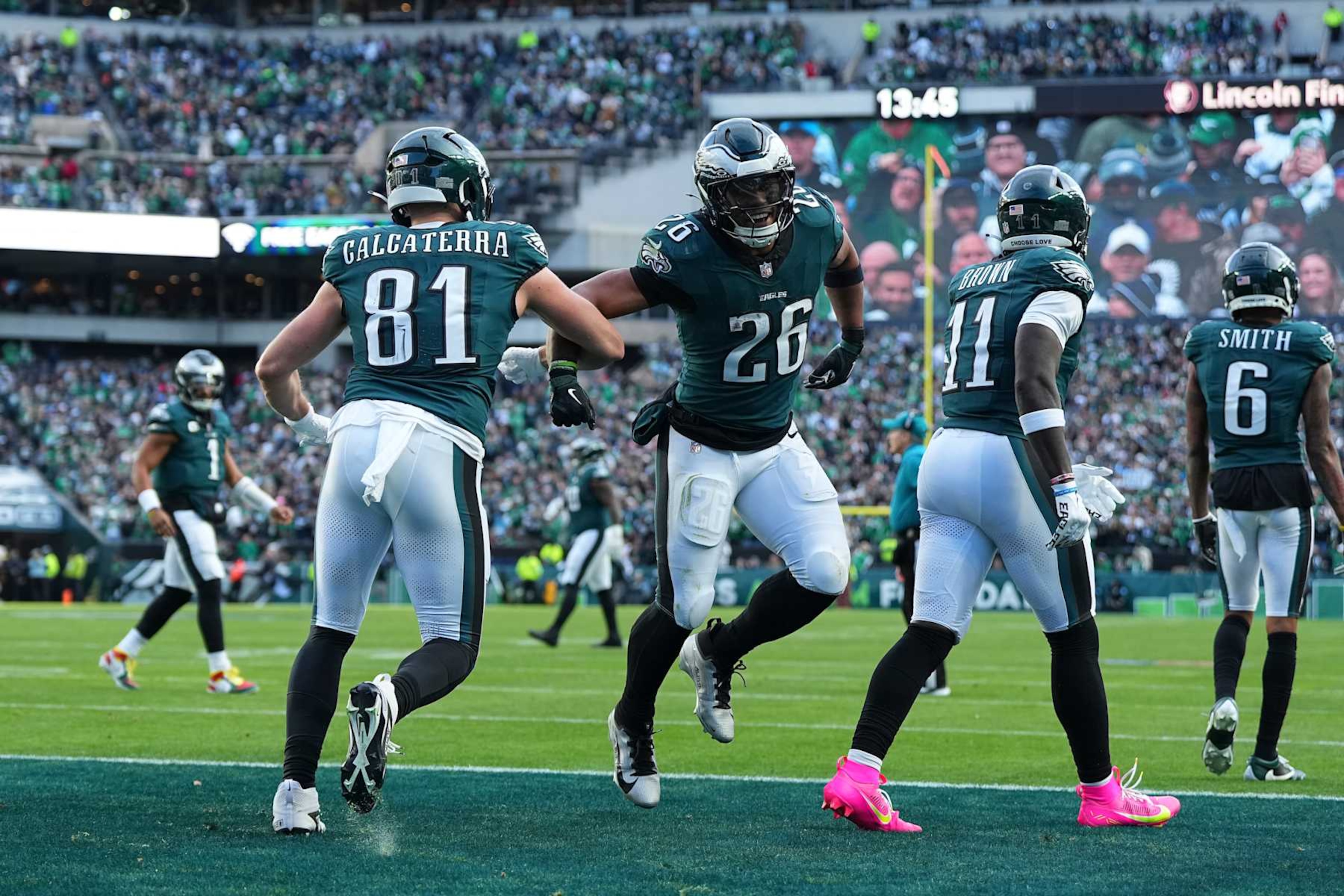 PHILADELPHIA, PENNSYLVANIA - DECEMBER 8: Grant Calcaterra #81 of the Philadelphia Eagles celebrates with Saquon Barkley #26 against the Carolina Panthers at Lincoln Financial Field on December 8, 2024 in Philadelphia, Pennsylvania. (Photo by Mitchell Leff/Getty Images)
