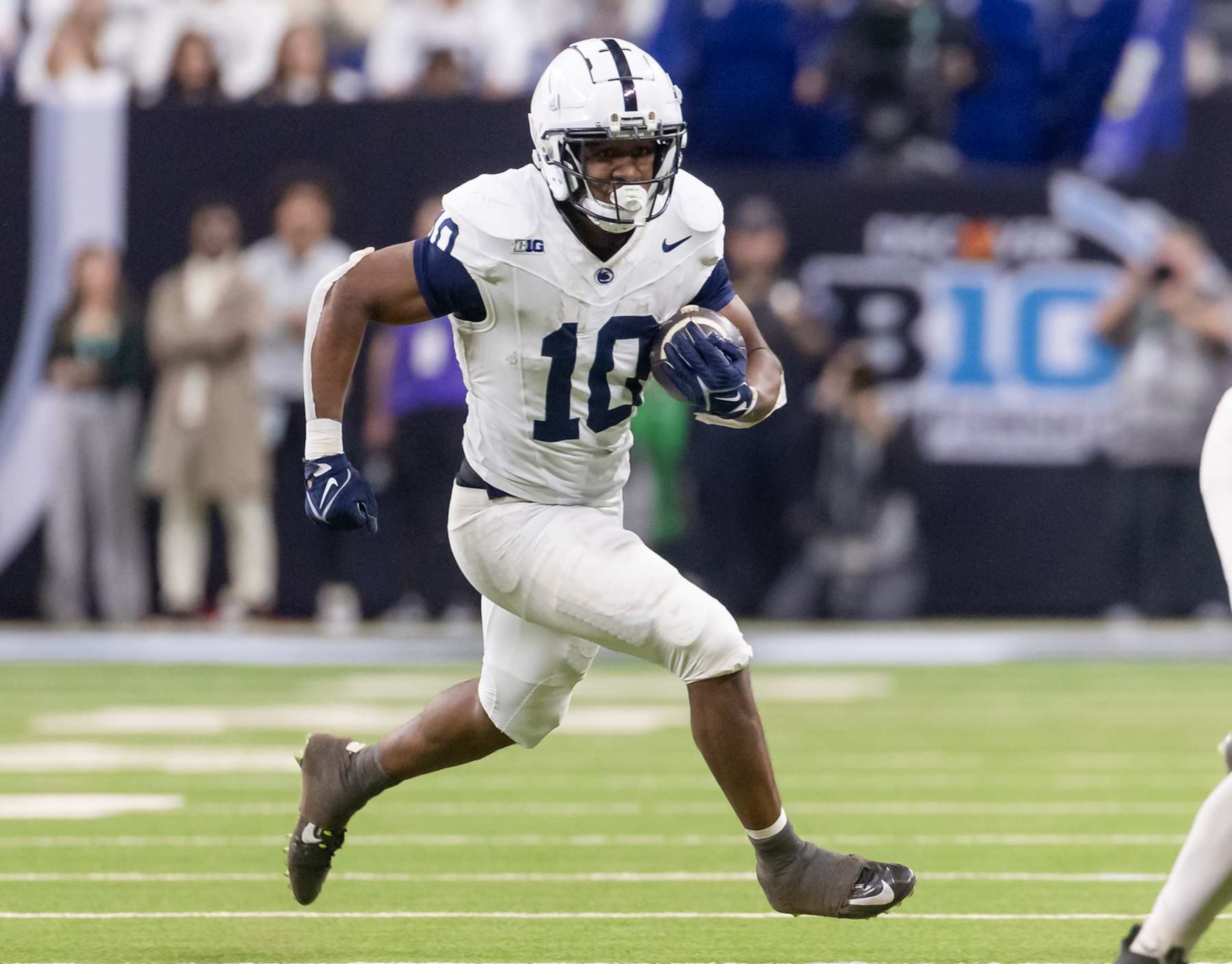 INDIANAPOLIS, INDIANA - DECEMBER 7: Nicholas Singleton #10 of the Penn State Nittany Lions runs the ball against the Oregon Ducks during the Big Ten Championship at Lucas Oil Stadium on December 7, 2024 in Indianapolis, Indiana. (Photo by Michael Hickey/Getty Images)