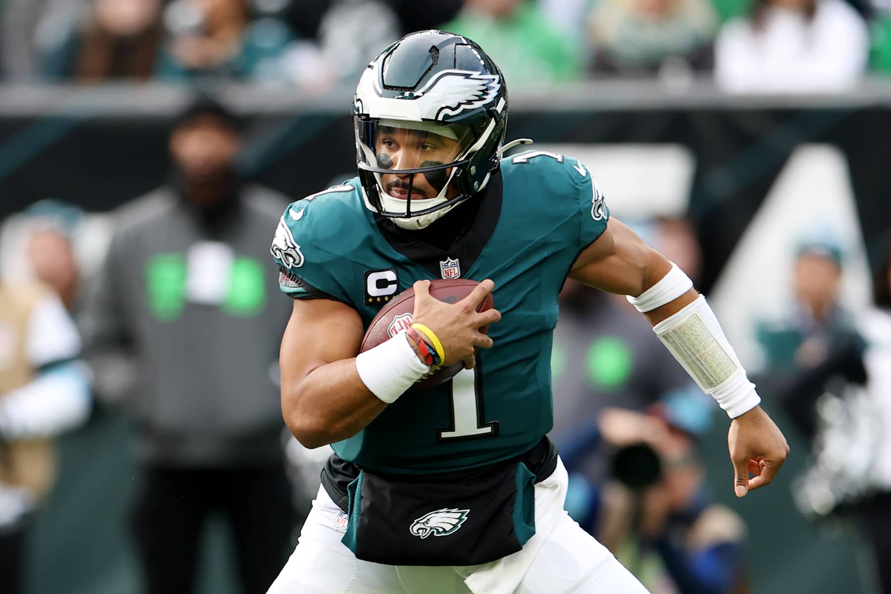 PHILADELPHIA, PENNSYLVANIA - DECEMBER 08: Jalen Hurts #1 of the Philadelphia Eagles carries the ball during a game against the Carolina Panthers at Lincoln Financial Field on December 08, 2024 in Philadelphia, Pennsylvania. (Photo by Emilee Chinn/Getty Images)