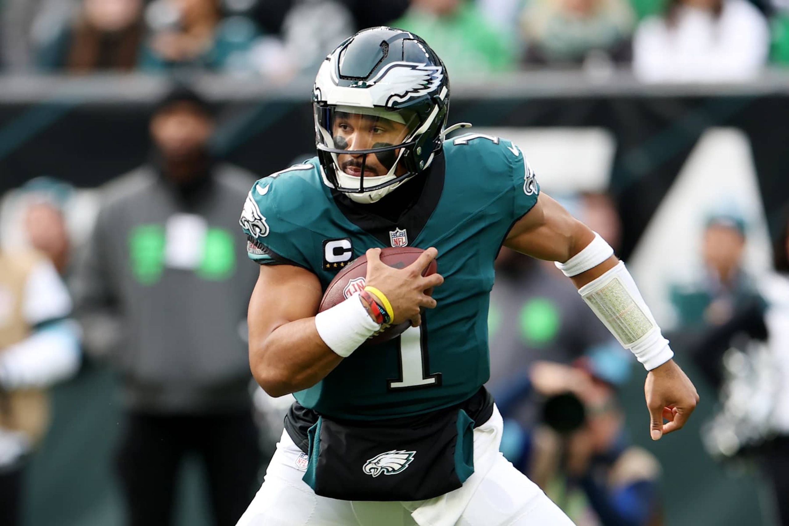 PHILADELPHIA, PENNSYLVANIA - DECEMBER 08: Jalen Hurts #1 of the Philadelphia Eagles carries the ball during a game against the Carolina Panthers at Lincoln Financial Field on December 08, 2024 in Philadelphia, Pennsylvania. (Photo by Emilee Chinn/Getty Images)