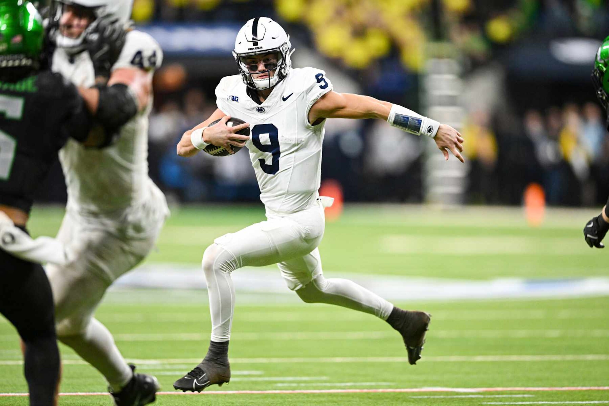 INDIANAPOLIS, IN - DECEMBER 07: Penn State Nittany Lions QB Beau Pribula (9) runs with the ball during the Big Ten Championship football game between the Penn State Nittany Lions and the Oregon Ducks on December 7, 2024 at Lucas Oil Stadium in Indianapolis, IN (Photo by James Black/Icon Sportswire via Getty Images) INDIANAPOLIS, IN - DECEMBER 07: Penn State Nittany Lions QB Beau Pribula (9) runs with the ball during the Big Ten Championship football game between the Penn State Nittany Lions and the Oregon Ducks on December 7, 2024 at Lucas Oil Stadium in Indianapolis, IN (Photo by James Black/Icon Sportswire via Getty Images)