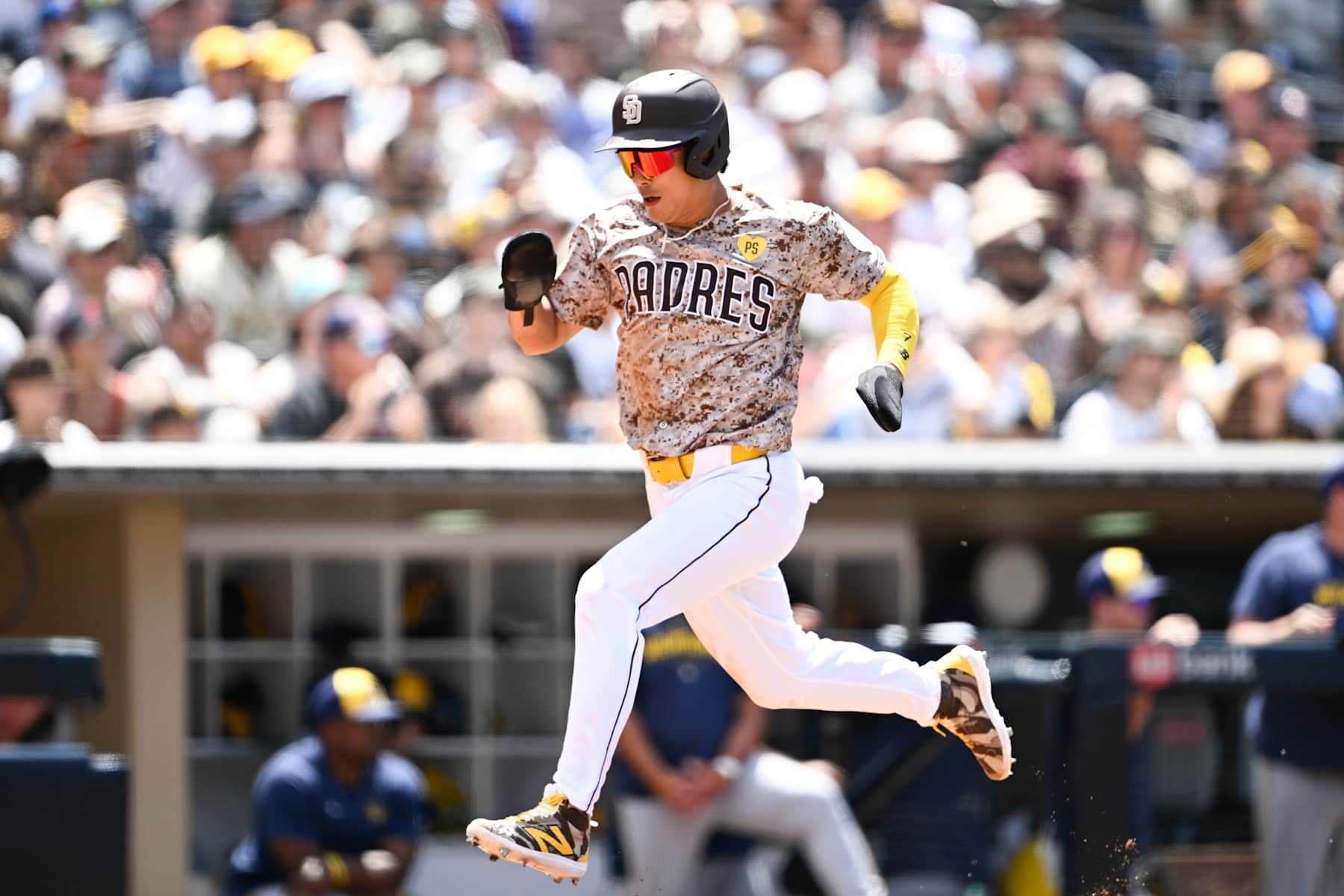 SAN DIEGO, CA - JUNE 23:  Ha-Seong Kim #7 of the San Diego Padres scores during the fifth inning of a baseball game against the Milwaukee Brewers June 23, 2024 at Petco Park in San Diego, California. (Photo by Denis Poroy/Getty Images)