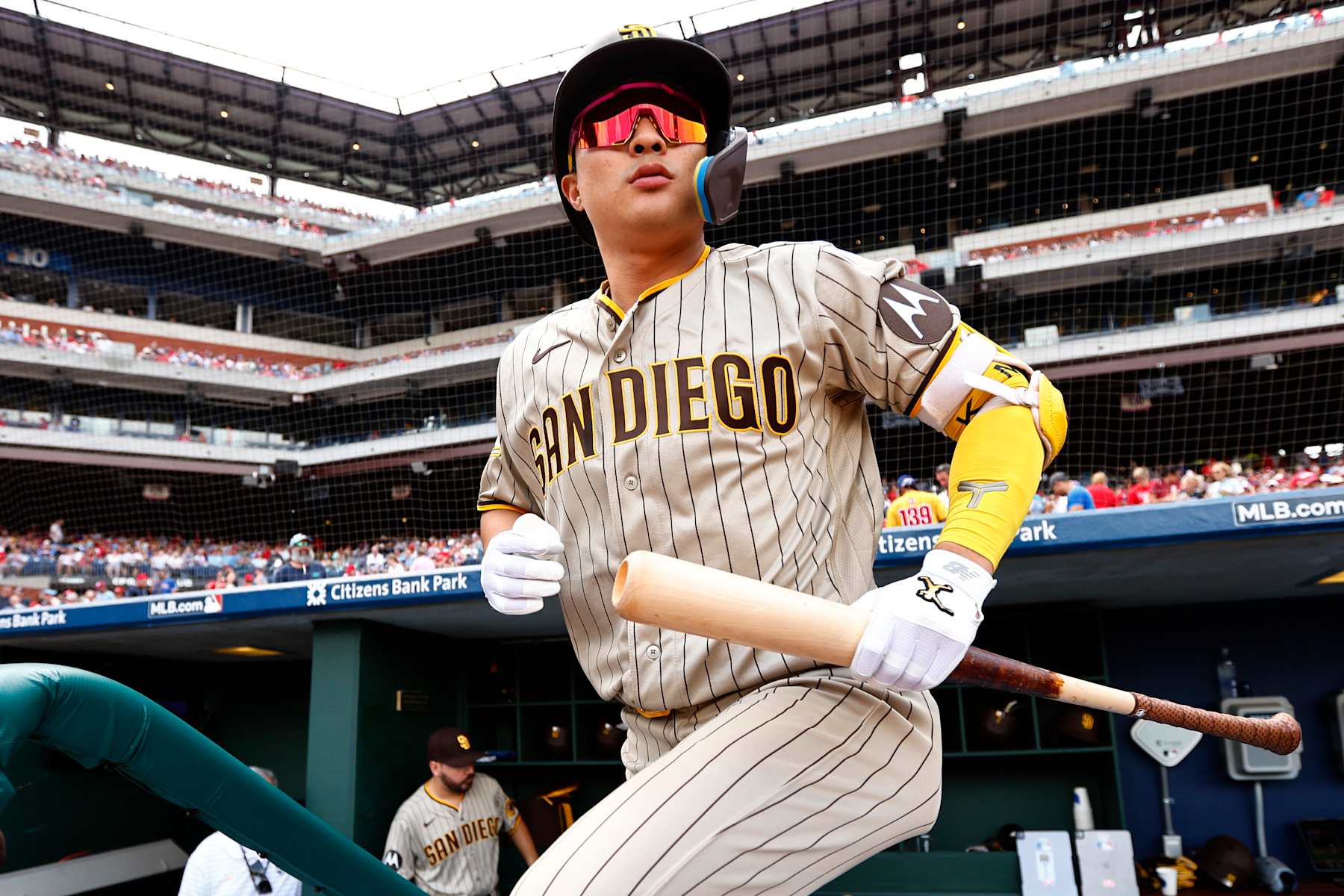 PHILADELPHIA, PENNSYLVANIA - JULY 15: Ha-Seong Kim #7 of the San Diego Padres walks out of the dugout for his first at bat against the Philadelphia Phillies during game one of a double header at Citizens Bank Park on July 15, 2023 in Philadelphia, Pennsylvania. (Photo by Rich Schultz/Getty Images)