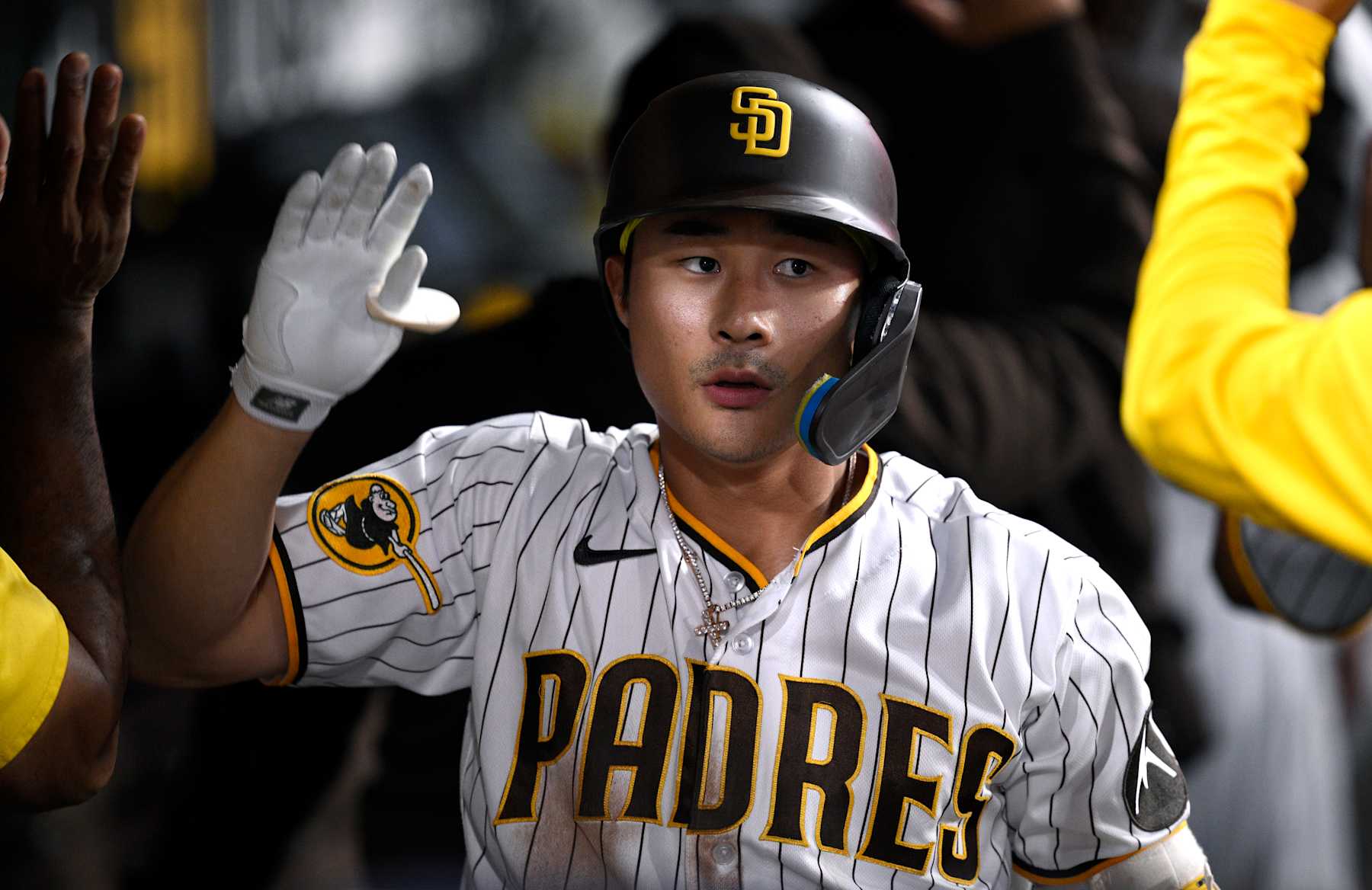 SAN DIEGO, CALIFORNIA - JULY 24: Ha-seong Kim #7 of the San Diego Padres is congratulated in the dugout after hitting a home run against the Pittsburgh Pirates during the fifth inning at PETCO Park on July 24, 2023 in San Diego, California. (Photo by Orlando Ramirez/Getty Images)