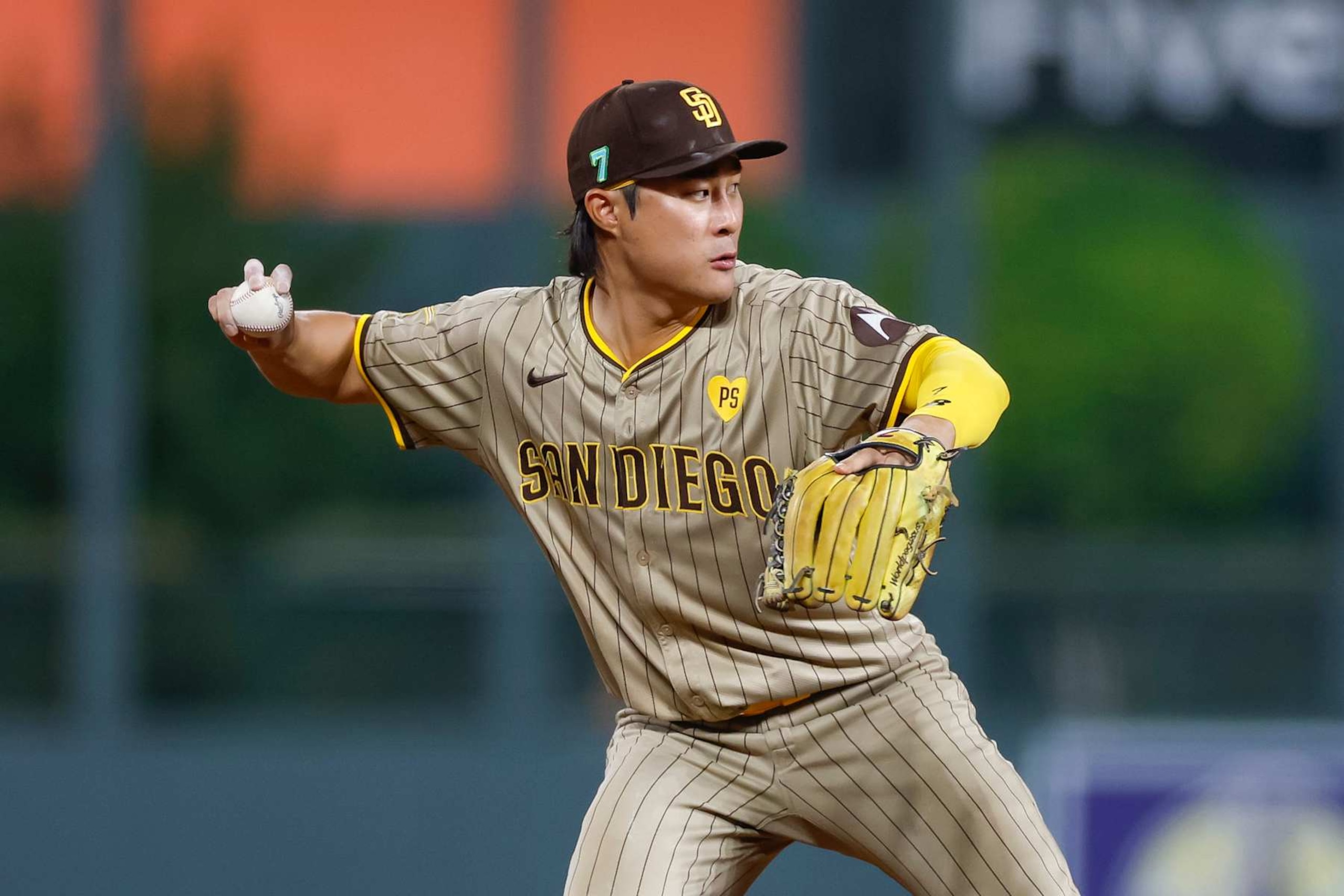 DENVER, COLORADO - AUGUST 16: Ha-Seong Kim #7 of the San Diego Padres throws to first base for an out in the seventh inning during a game against the Colorado Rockies at Coors Field on August 16, 2024 in Denver, Colorado. (Photo by Brandon Sloter/Image Of Sport/Getty Images)