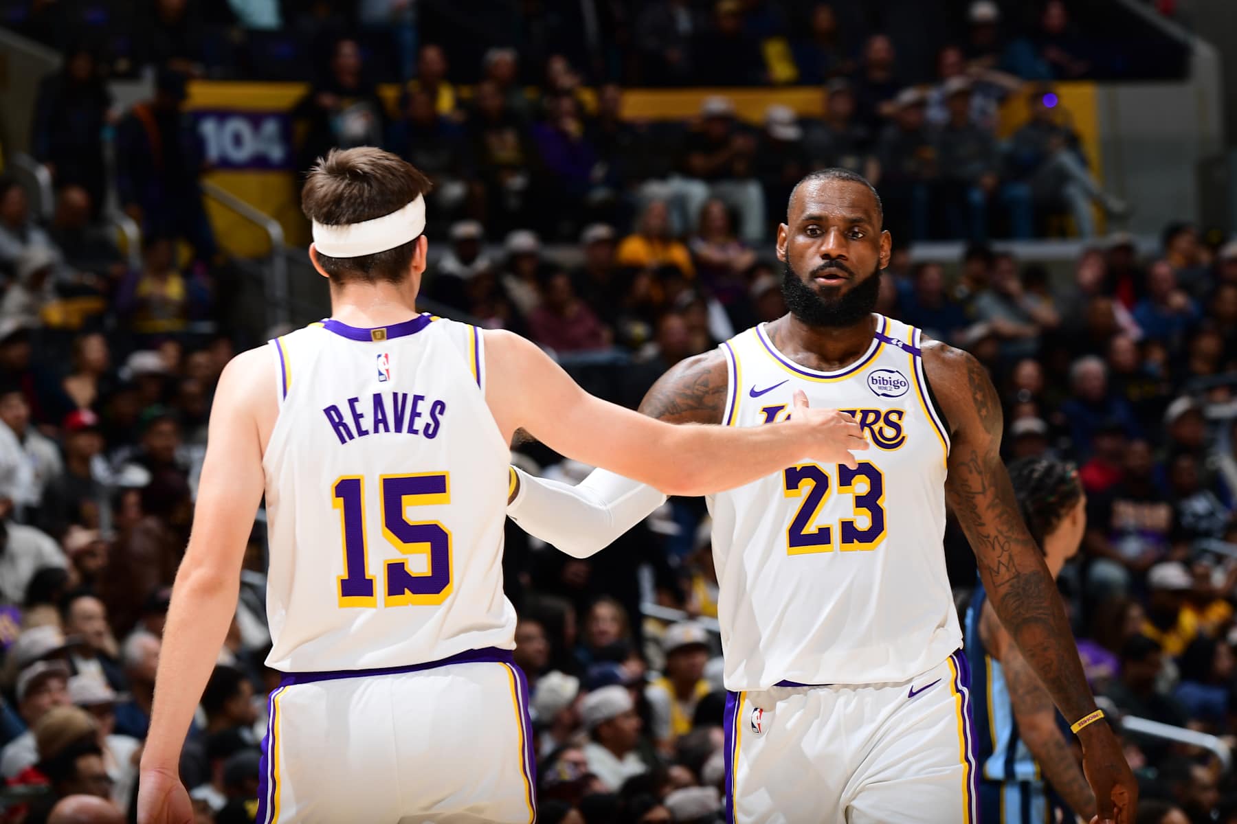 LOS ANGELES, CA - DECEMBER 15: LeBron James #23 and Austin Reaves #15 of the Los Angeles Lakers high five during the game against the Memphis Grizzlies on December 15, 2024 at Crypto.Com Arena in Los Angeles, California. NOTE TO USER: User expressly acknowledges and agrees that, by downloading and/or using this Photograph, user is consenting to the terms and conditions of the Getty Images License Agreement. Mandatory Copyright Notice: Copyright 2024 NBAE (Photo by Adam Pantozzi/NBAE via Getty Images)