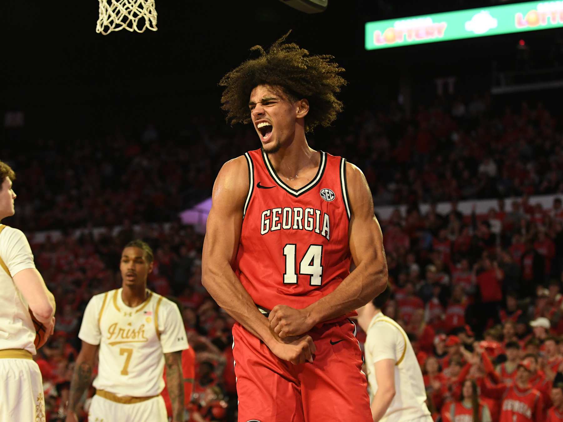 ATHENS, GA - DECEMBER 03: Georgia Bulldogs forward Asa Newell (14) celebrates a score during the college basketball game between the Notre Dame Fighting Irish and the Georgia Bulldogs on December 03, 2024, at Stegeman Coliseum in Athens, GA. (Photo by Jeffrey Vest/Icon Sportswire via Getty Images)