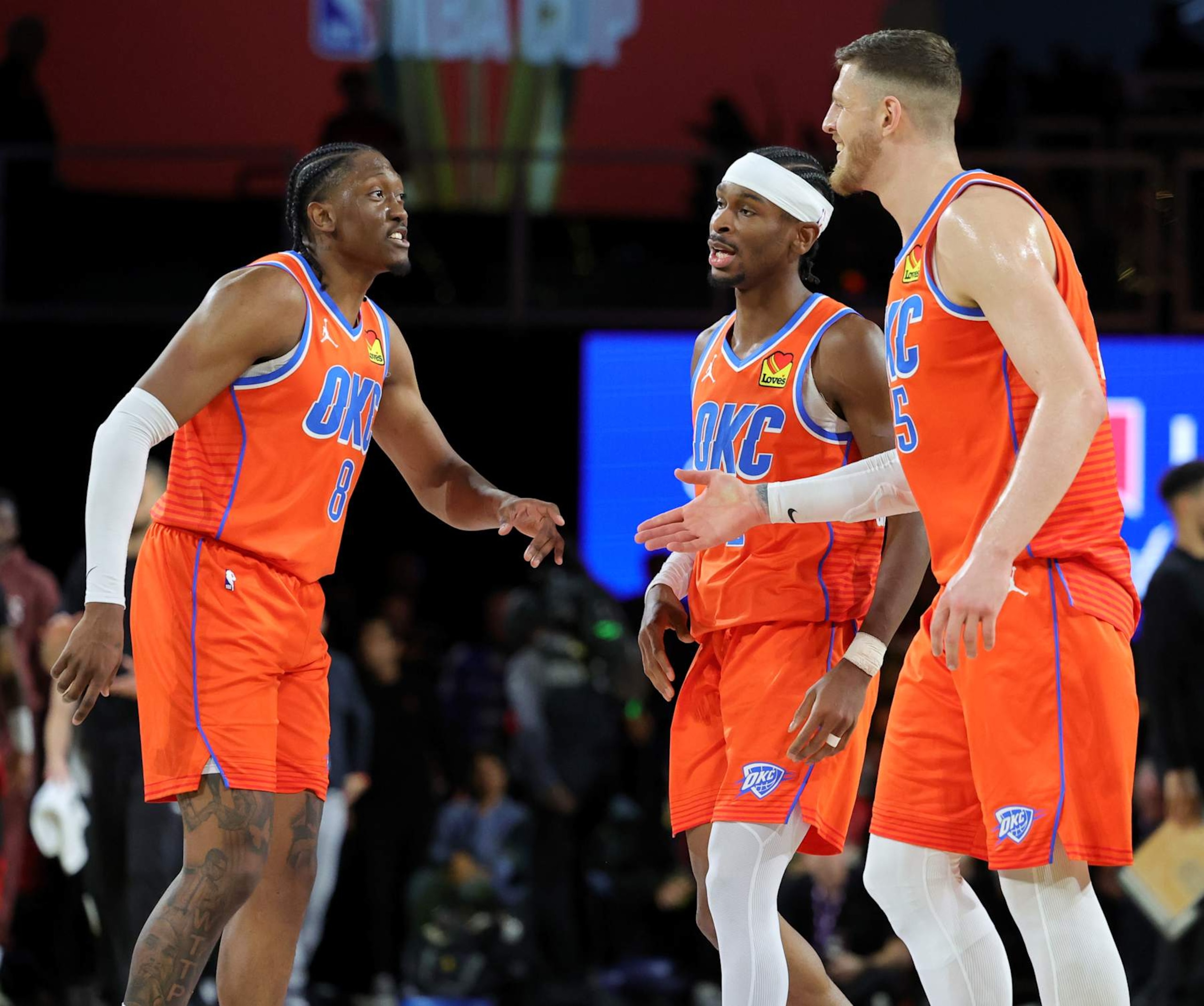 LAS VEGAS, NEVADA - DECEMBER 14: Jalen Williams #8, Shai Gilgeous-Alexander #2 and Isaiah Hartenstein #55 of the Oklahoma City Thunder react on the court after a timeout was called in the second half of a semifinal game of the Emirates NBA Cup against the Houston Rockets at T-Mobile Arena on December 14, 2024 in Las Vegas, Nevada. The Thunder defeated the Rockets 111-96. NOTE TO USER: User expressly acknowledges and agrees that, by downloading and or using this photograph, User is consenting to the terms and conditions of the Getty Images License Agreement. (Photo by Ethan Miller/Getty Images)