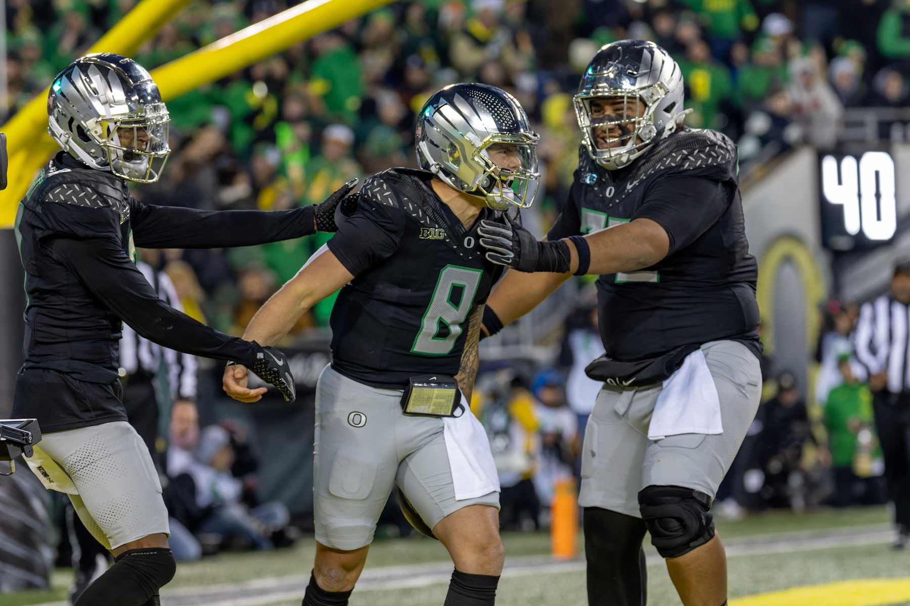 EUGENE, OREGON - NOVEMBER 30: Quarterback Dillon Gabriel #8 of the Oregon Ducks celebrates a touchdown during their game against the Washington Huskies at Autzen Stadium on November 30, 2024 in Eugene, Oregon. (Photo by Tom Hauck/Getty Images)