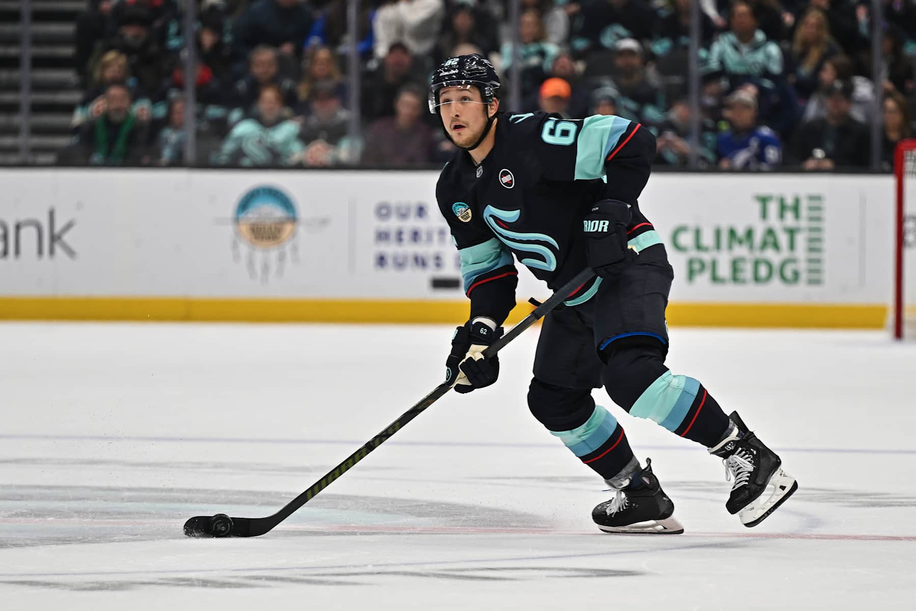 SEATTLE, WASHINGTON - DECEMBER 14: Brandon Montour #62 of the Seattle Kraken looks to move the puck during the second period against the Tampa Bay Lightning at Climate Pledge Arena on December 14, 2024 in Seattle, Washington. (Photo by Alika Jenner/Getty Images)