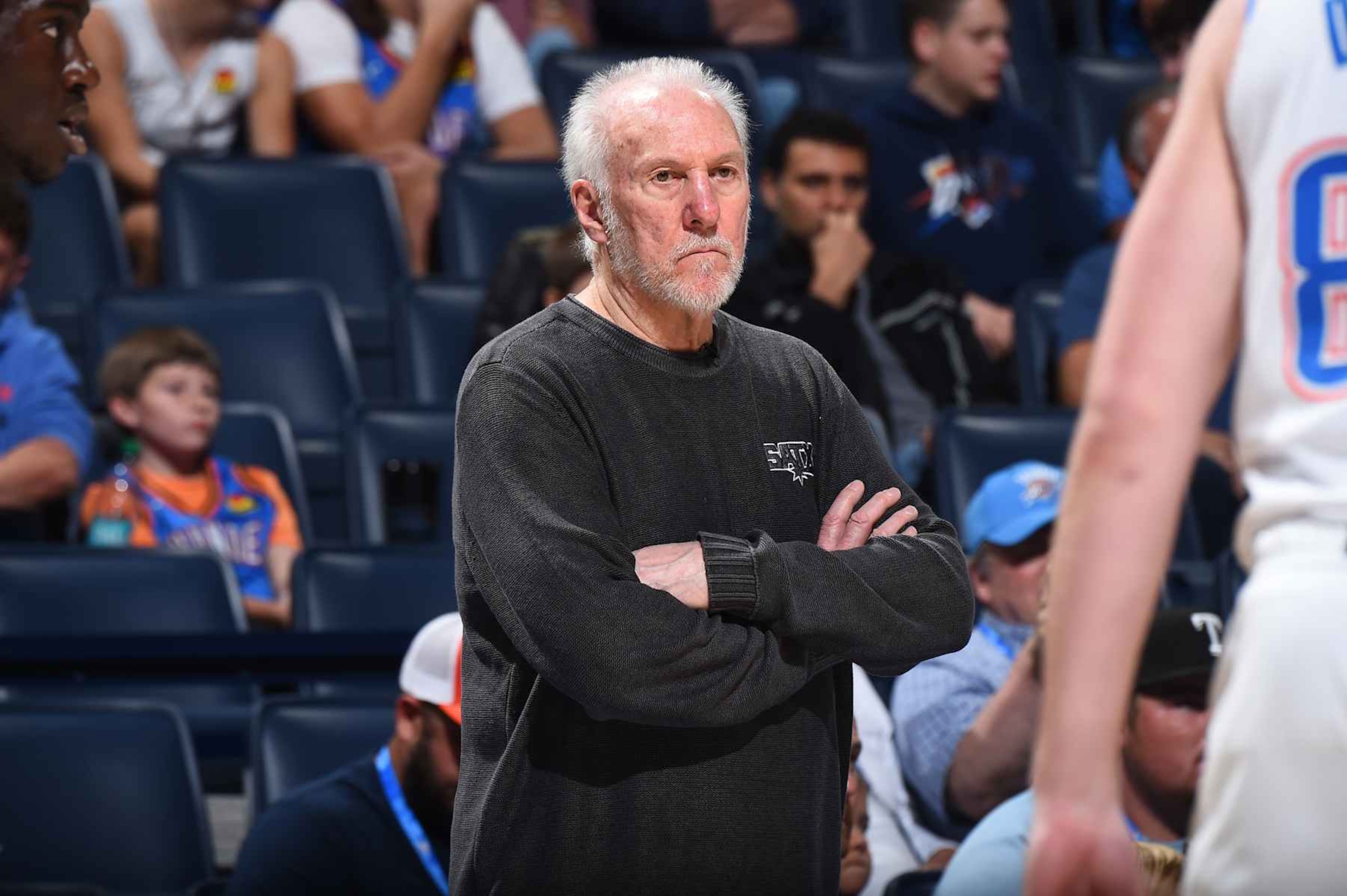 OKLAHOMA CITY, OK - OCTOBER 30: Head Coach Gregg Popovich of the San Antonio Spurs looks on during the game against the Oklahoma City Thunder on October 30, 2024 at Paycom Center in Oklahoma City, Oklahoma. NOTE TO USER: User expressly acknowledges and agrees that, by downloading and or using this photograph, User is consenting to the terms and conditions of the Getty Images License Agreement. Mandatory Copyright Notice: Copyright 2024 NBAE (Photo by Brian Babineau/NBAE via Getty Images) OKLAHOMA CITY, OK - OCTOBER 30: Head Coach Gregg Popovich of the San Antonio Spurs looks on during the game against the Oklahoma City Thunder on October 30, 2024 at Paycom Center in Oklahoma City, Oklahoma. NOTE TO USER: User expressly acknowledges and agrees that, by downloading and or using this photograph, User is consenting to the terms and conditions of the Getty Images License Agreement. Mandatory Copyright Notice: Copyright 2024 NBAE (Photo by Brian Babineau/NBAE via Getty Images)