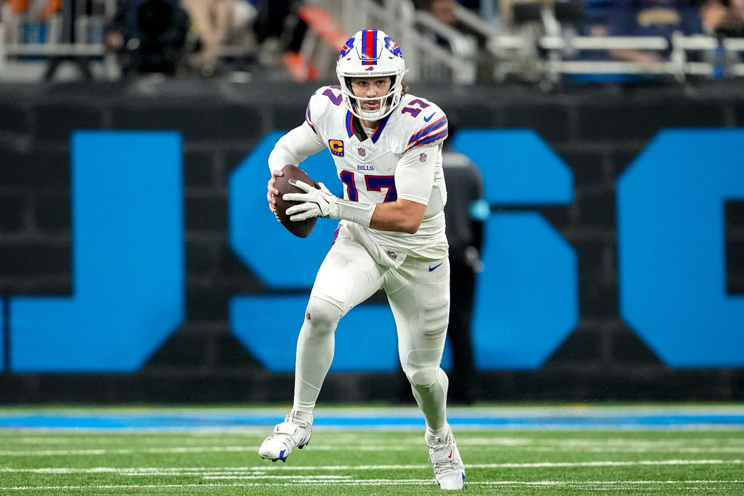 DETROIT, MICHIGAN - DECEMBER 15: Josh Allen #17 of the Buffalo Bills runs in action with the football against the Detroit Lions at Ford Field on December 15, 2024 in Detroit, Michigan. (Photo by Nic Antaya/Getty Images)