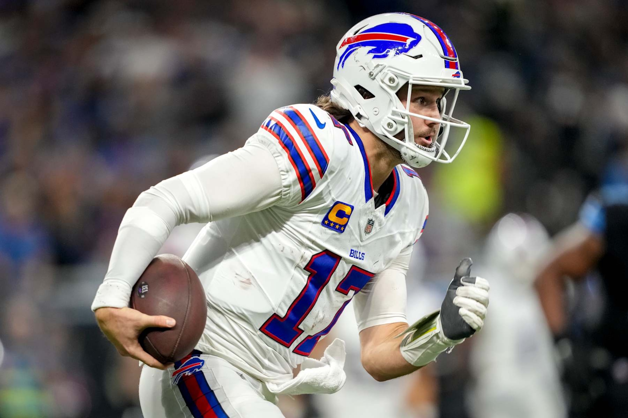 DETROIT, MICHIGAN - DECEMBER 15: Josh Allen #17 of the Buffalo Bills runs in action with the football against the Detroit Lions at Ford Field on December 15, 2024 in Detroit, Michigan. (Photo by Nic Antaya/Getty Images)
