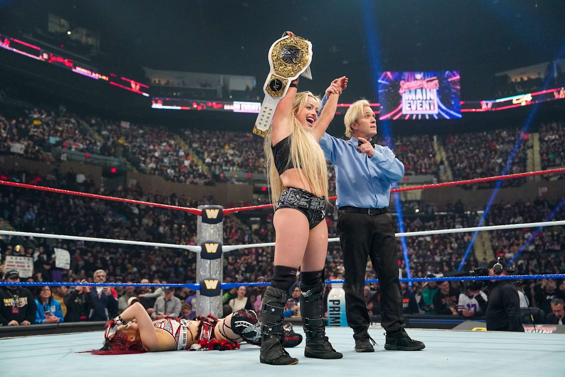 UNIONDALE, NEW YORK - DECEMBER 14: Liv Morgan wins match against Iyo Sky during Saturday Night Main Event at Nassau Veterans Memorial Coliseum on December 14, 2024 in Uniondale, New York.  (Photo by WWE/Getty Images)