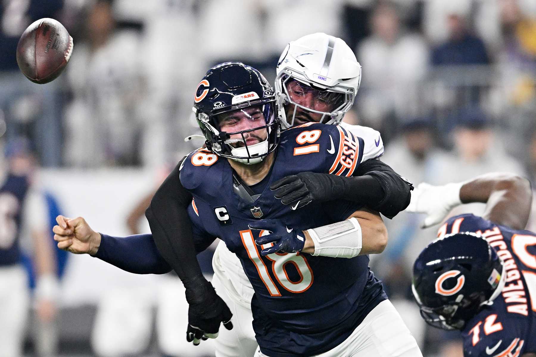 MINNEAPOLIS, MINNESOTA - DECEMBER 16: Jonathan Greenard #58 of the Minnesota Vikings strips sacks Caleb Williams #18 of the Chicago Bears during the first quarter at U.S. Bank Stadium on December 16, 2024 in Minneapolis, Minnesota. Minnesota recovered the ball on the play. (Photo by Stephen Maturen/Getty Images)