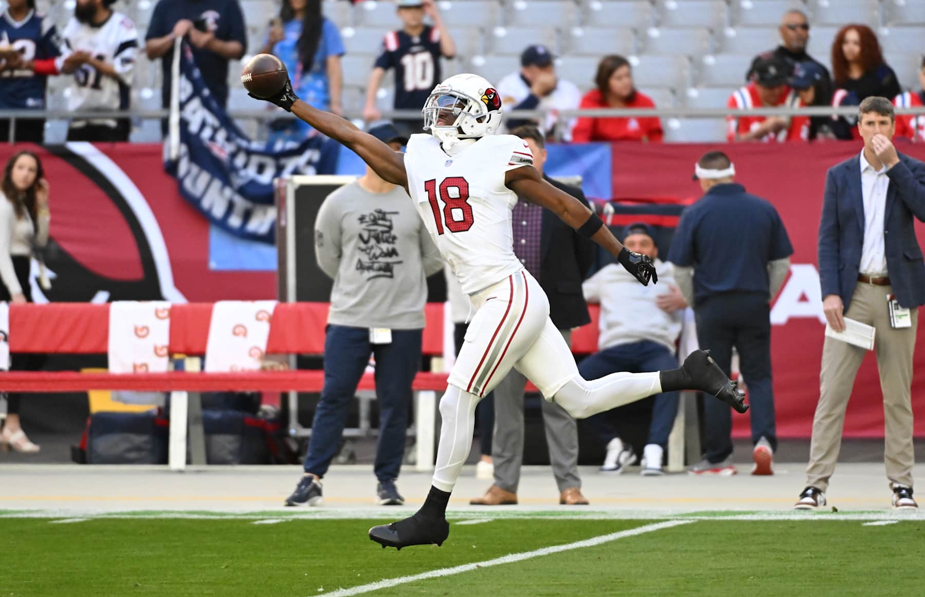 GLENDALE, ARIZONA - DECEMBER 15: Marvin Harrison Jr #18 of the Arizona Cardinals prepares for a game against the New England Patriots at State Farm Stadium on December 15, 2024 in Glendale, Arizona.  (Photo by Norm Hall/Getty Images)