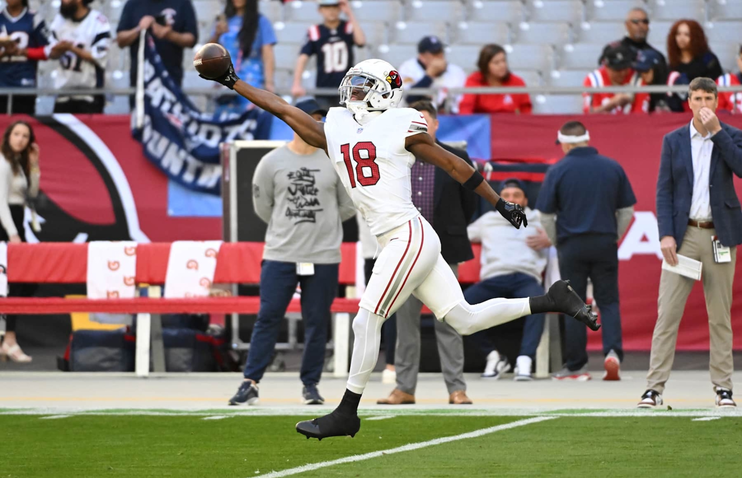 GLENDALE, ARIZONA - DECEMBER 15: Marvin Harrison Jr #18 of the Arizona Cardinals prepares for a game against the New England Patriots at State Farm Stadium on December 15, 2024 in Glendale, Arizona.  (Photo by Norm Hall/Getty Images)