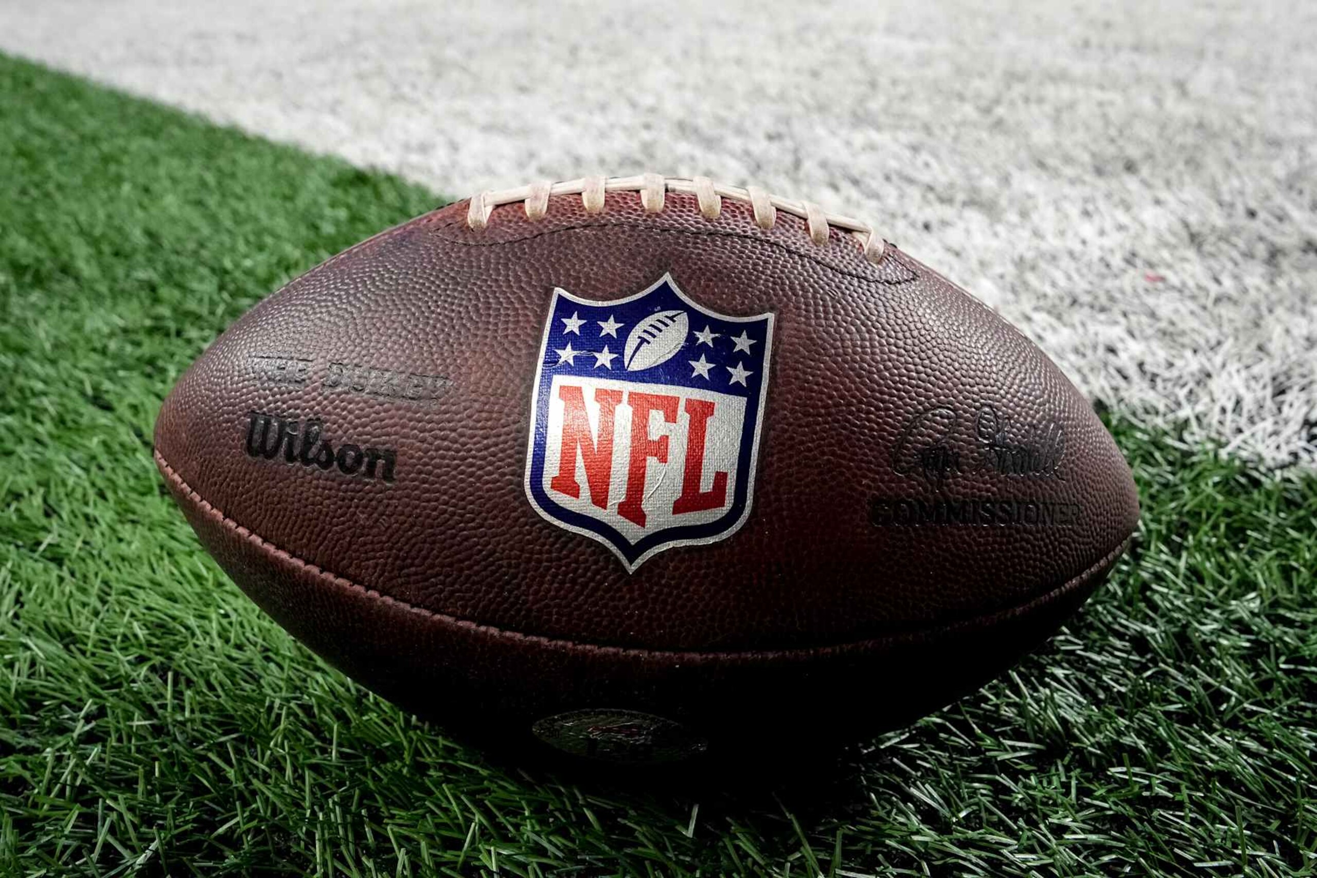 DETROIT, MICHIGAN - DECEMBER 15: A detailed view of a Wilson brand NFL football with the logos on the field before the game between the Detroit Lions and Buffalo Bills at Ford Field on December 15, 2024 in Detroit, Michigan. (Photo by Nic Antaya/Getty Images)
