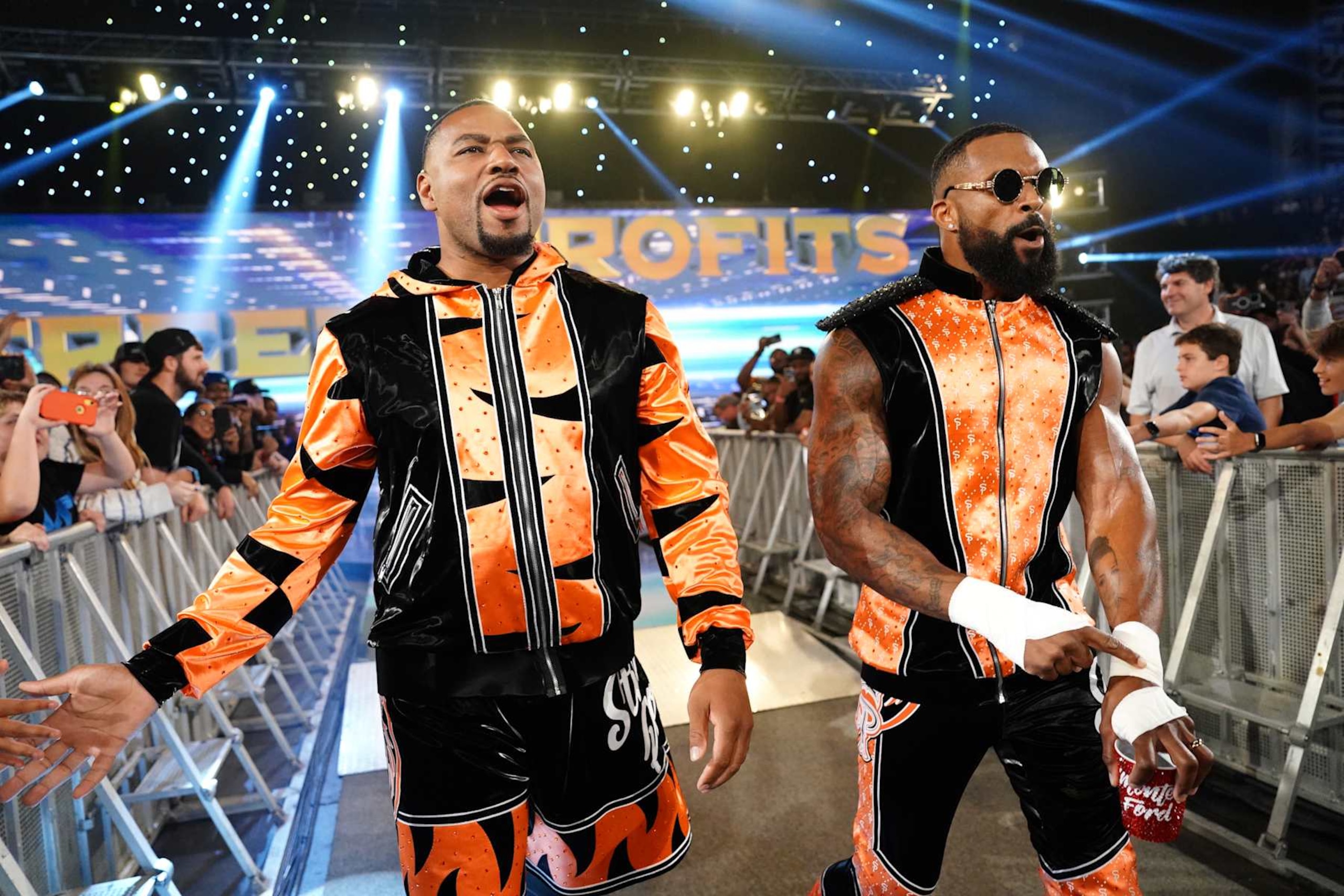 NASHVILLE, TENNESSEE - OCTOBER 4: (L-R) Angelo Dawkins and Montez Ford of the Street Profits make their entrance during WWE SmackDown at Bridgestone Arena on October 4, 2024 in Nashville, Tennessee.  (Photo by WWE/Getty Images)