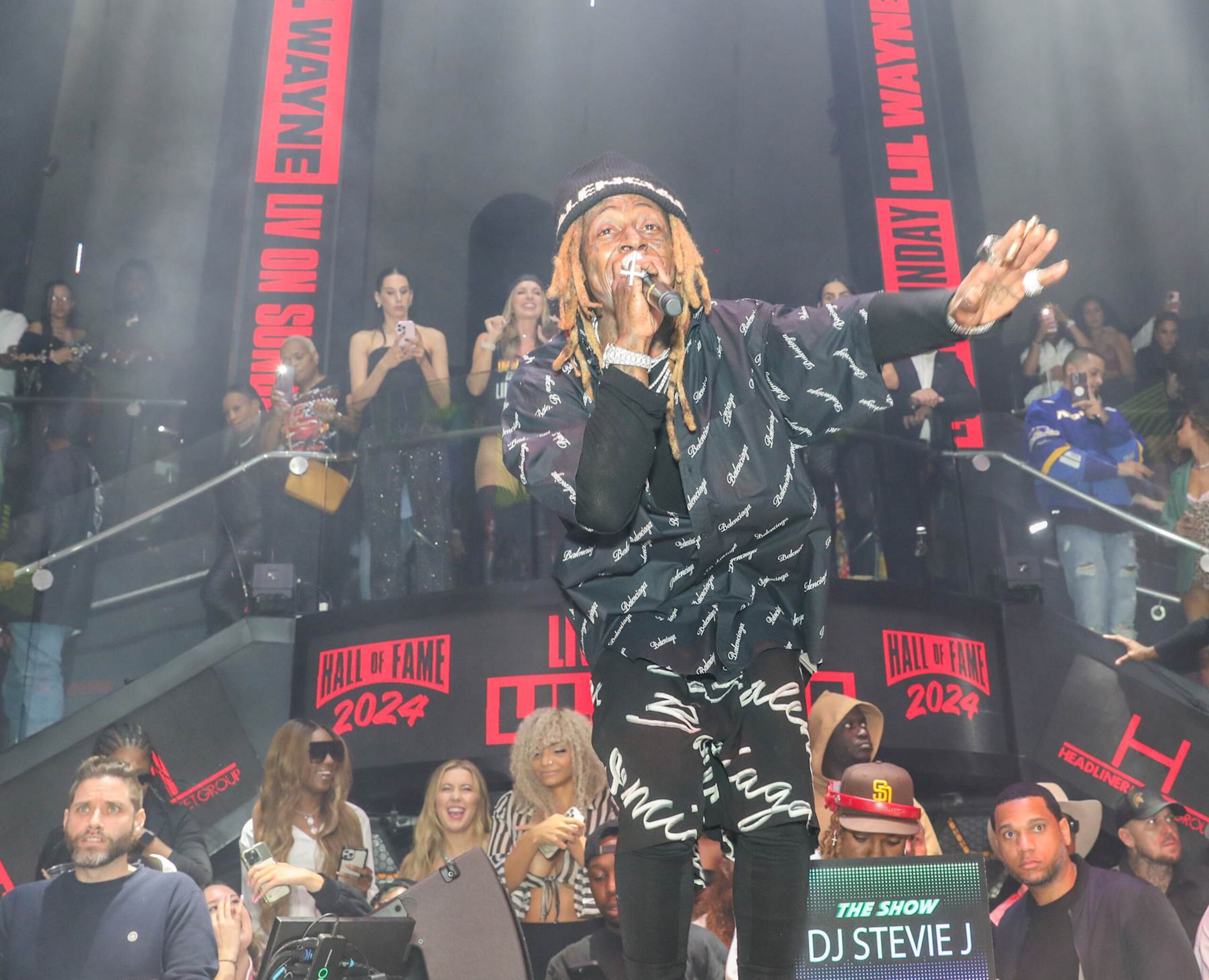 MIAMI BEACH, FLORIDA - DECEMBER 8: Lil Wayne performs at LIV Nightclub at Fontainebleau Miami on December 8, 2024 in Miami Beach, Florida. (Photo by Thaddaeus McAdams/Getty Images) MIAMI BEACH, FLORIDA - DECEMBER 8: Lil Wayne performs at LIV Nightclub at Fontainebleau Miami on December 8, 2024 in Miami Beach, Florida. (Photo by Thaddaeus McAdams/Getty Images)