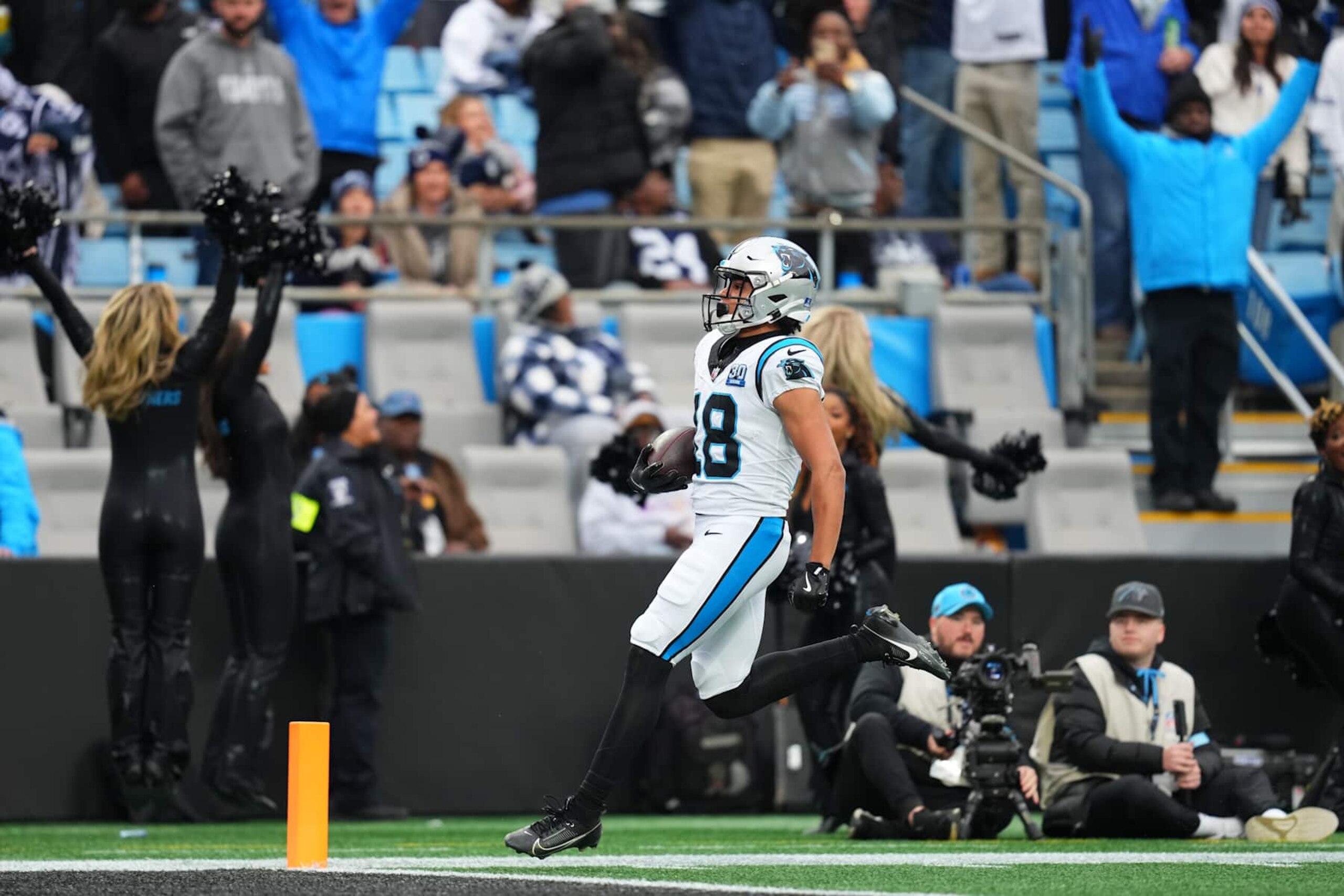 CHARLOTTE, NORTH CAROLINA - DECEMBER 15: Jalen Coker #18 of the Carolina Panthers runs in for a touchdown against the Dallas Cowboys during the second quarter at Bank of America Stadium on December 15, 2024 in Charlotte, North Carolina. (Photo by Grant Halverson/Getty Images) CHARLOTTE, NORTH CAROLINA - DECEMBER 15: Jalen Coker #18 of the Carolina Panthers runs in for a touchdown against the Dallas Cowboys during the second quarter at Bank of America Stadium on December 15, 2024 in Charlotte, North Carolina. (Photo by Grant Halverson/Getty Images)
