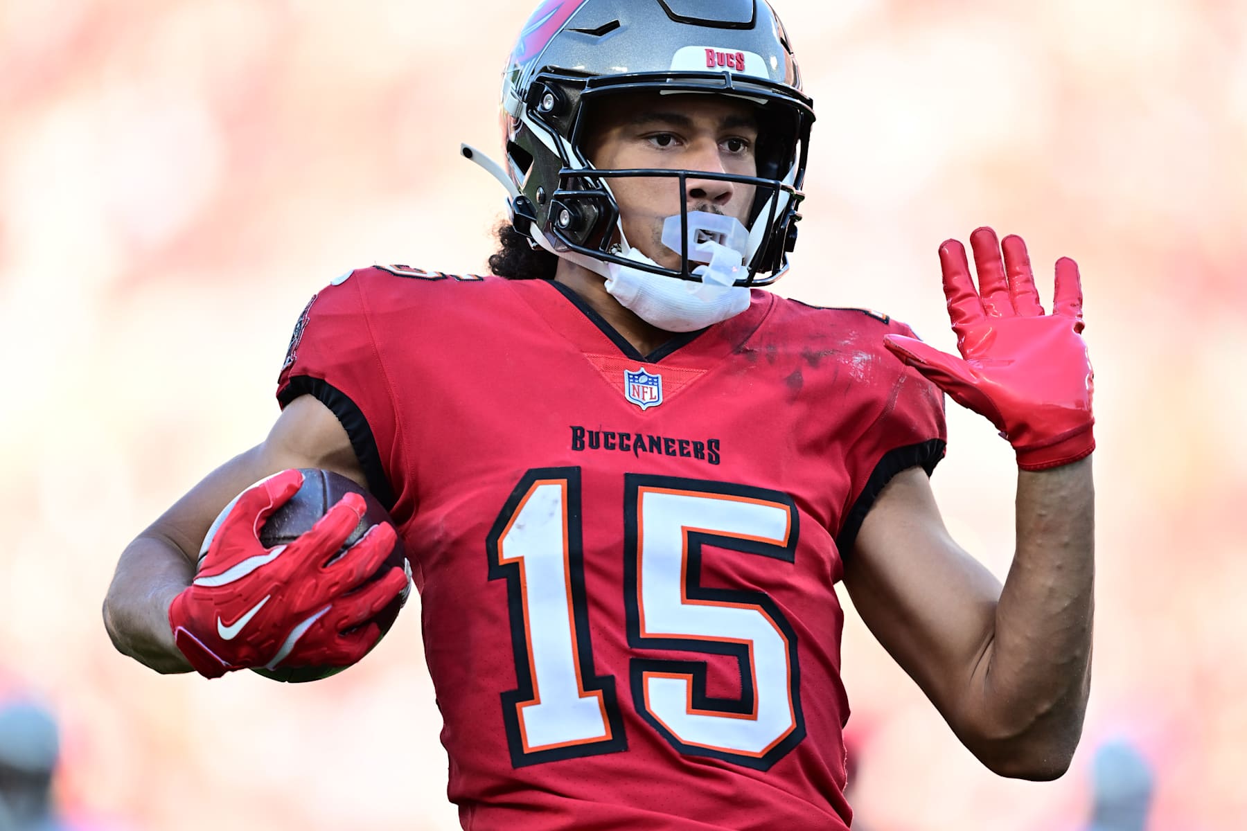 TAMPA, FLORIDA - DECEMBER 08: Jalen McMillan #15 of the Tampa Bay Buccaneers runs with the ball for a touchdown during the fourth quarter against the Las Vegas Raiders at Raymond James Stadium on December 08, 2024 in Tampa, Florida. (Photo by Julio Aguilar/Getty Images)