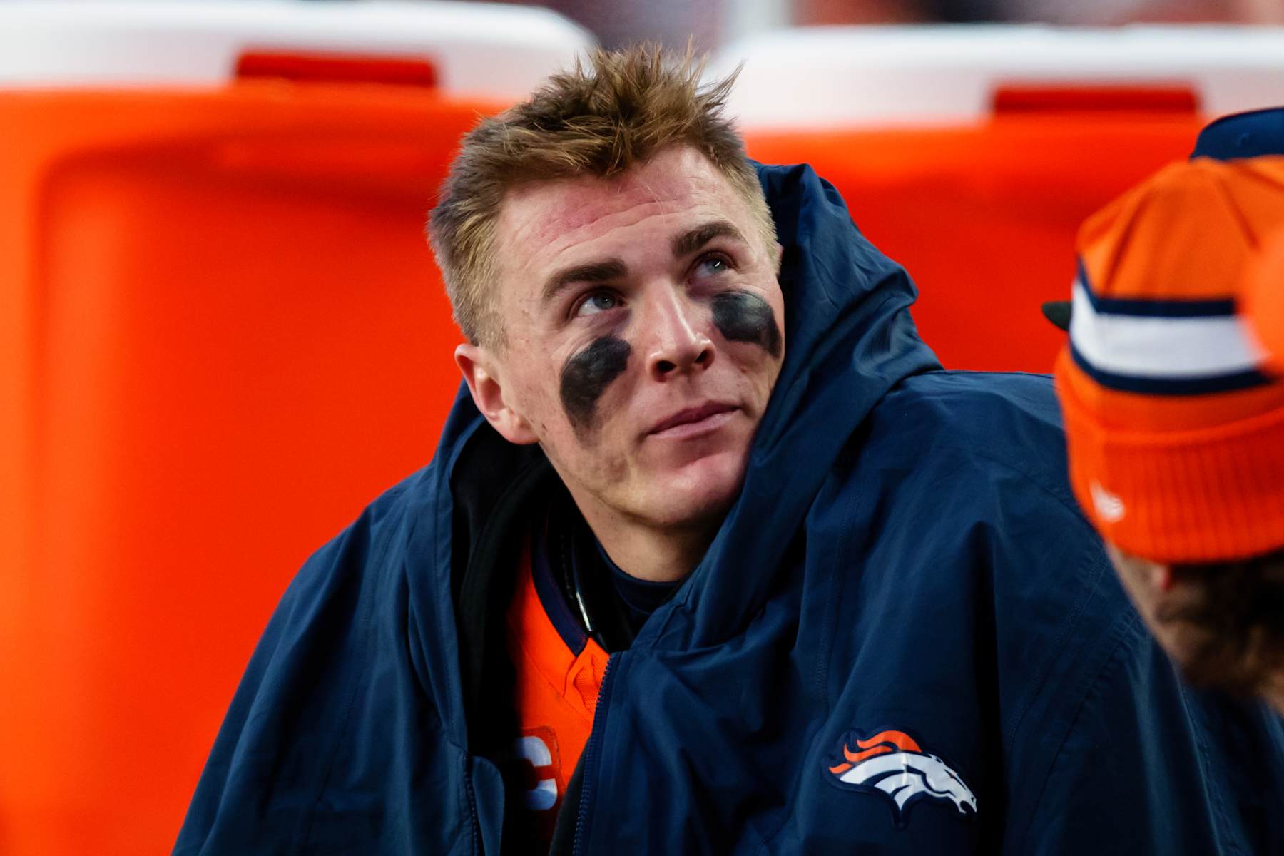 DENVER, CO - DECEMBER 15:  Quarterback Bo Nix #10 of the Denver Broncos looks at the scoreboard sitting on the bench during the third quarter against the Indianapolis Colts at Empower Field at Mile High on December 15, 2024 in Denver, Colorado. (Photo by Justin Edmonds/Getty Images)