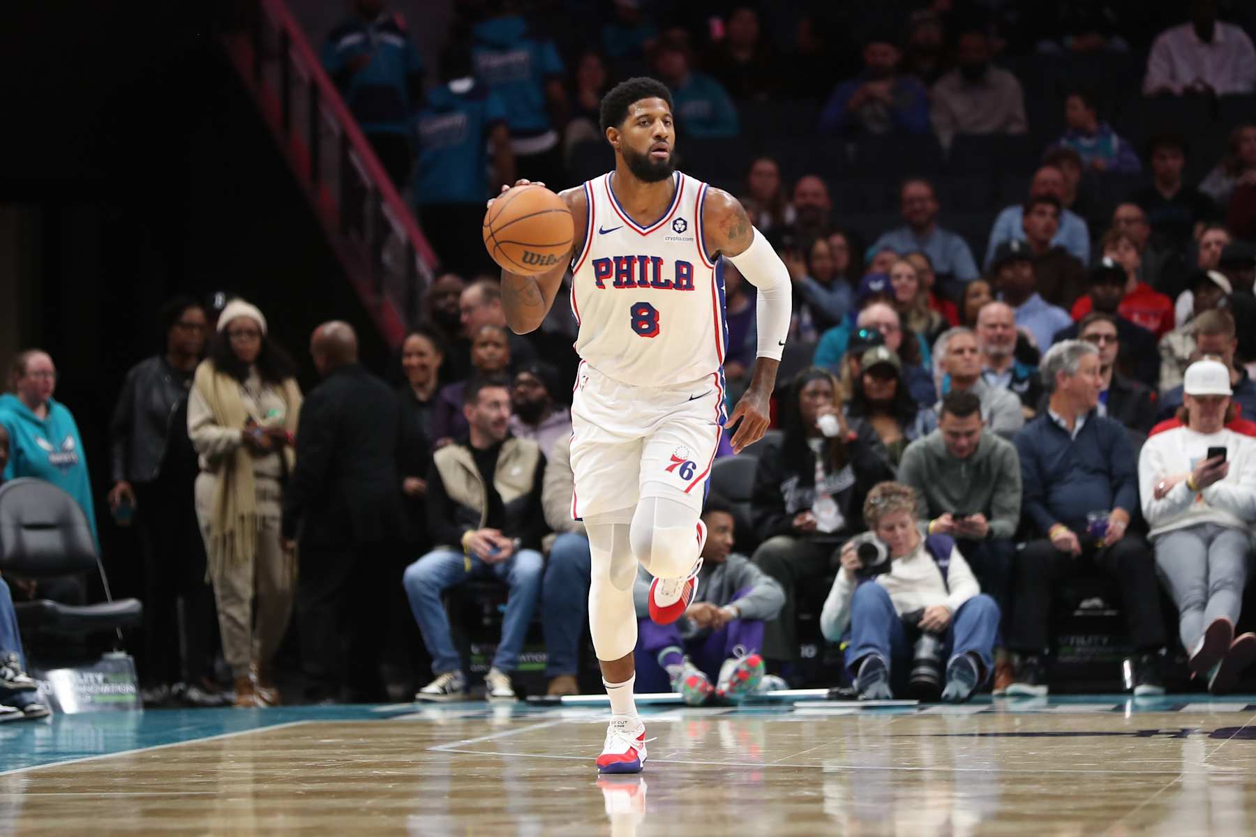 CHARLOTTE, NC - DECEMBER 16:  Paul George #8 of the Philadelphia 76ers dribbles the ball during the game against the Charlotte Hornets on December 16, 2024 at Spectrum Center in Charlotte, North Carolina. NOTE TO USER: User expressly acknowledges and agrees that, by downloading and or using this photograph, User is consenting to the terms and conditions of the Getty Images License Agreement. Mandatory Copyright Notice: Copyright 2024 NBAE (Photo by Brock Williams-Smith/NBAE via Getty Images)