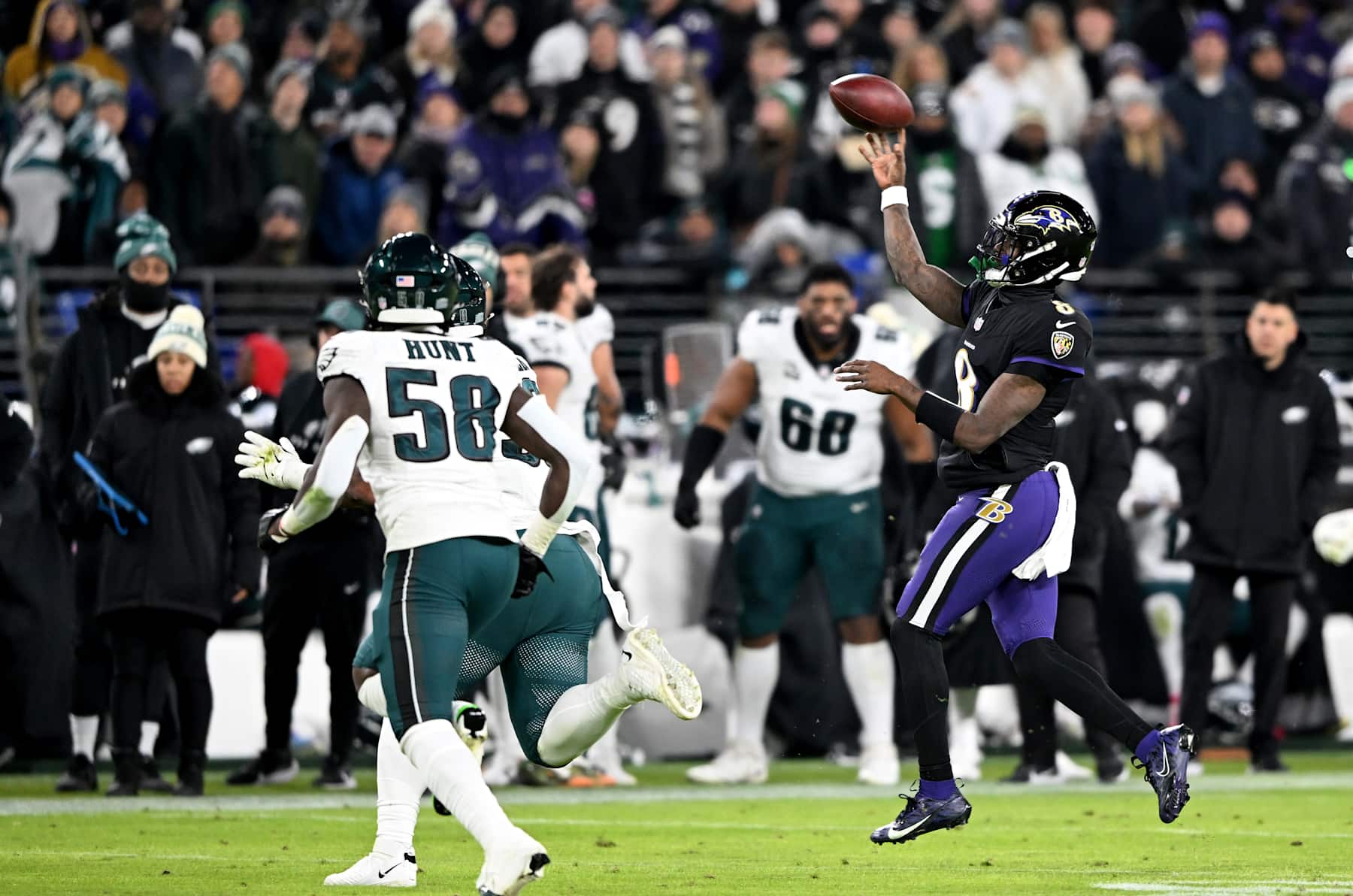 BALTIMORE, MARYLAND - DECEMBER 01: Lamar Jackson #8 of the Baltimore Ravens throws a pass against the Philadelphia Eagles at M&T Bank Stadium on December 01, 2024 in Baltimore, Maryland. (Photo by G Fiume/Getty Images)