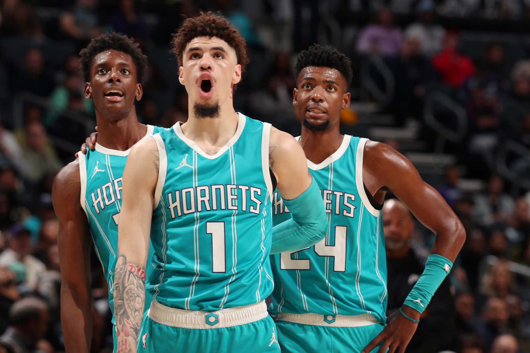 CHARLOTTE, NC - NOVEMBER 21: LaMelo Ball #1, Moussa Diabate #14 and Brandon Miller #24 of the Charlotte Hornets look on during the game against the Detroit Pistons on November 21, 2024 at Spectrum Center in Charlotte, North Carolina. NOTE TO USER: User expressly acknowledges and agrees that, by downloading and or using this photograph, User is consenting to the terms and conditions of the Getty Images License Agreement. Mandatory Copyright Notice: Copyright 2024 NBAE (Photo by Kent Smith/NBAE via Getty Images)
