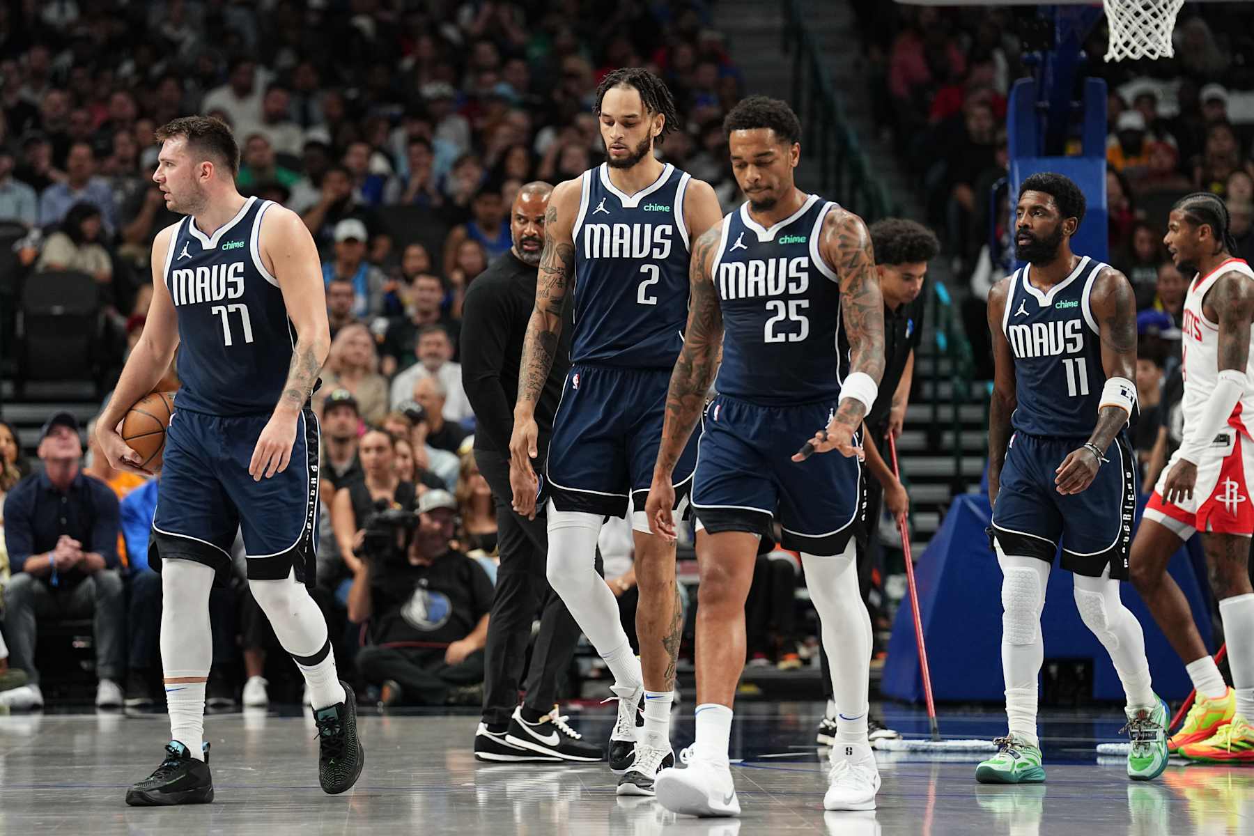 DALLAS, TX - OCTOBER 31: Luka Doncic #77, Dereck Lively II #2 , P.J Washington #25 , and Kyrie Irving #11 of the Dallas Mavericks look during the game against the Houston Rockets on October 31, 2024 at American Airlines Center in Dallas, Texas. NOTE TO USER: User expressly acknowledges and agrees that, by downloading and or using this photograph, User is consenting to the terms and conditions of the Getty Images License Agreement. Mandatory Copyright Notice: Copyright 2024 NBAE (Photo by Glenn James/NBAE via Getty Images)