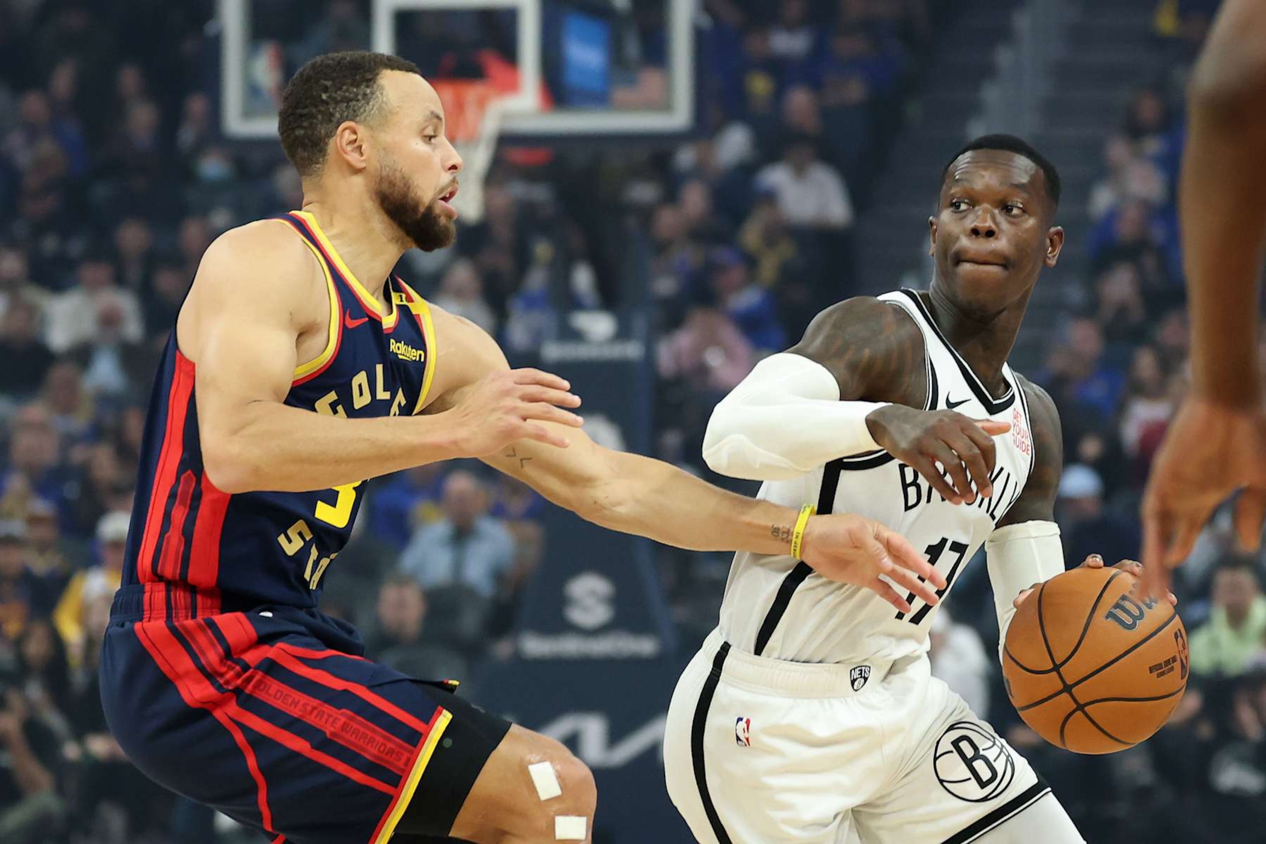 SAN FRANCISCO, CALIFORNIA - NOVEMBER 25: Dennis Schroder #17 of the Brooklyn Nets is guarded by Stephen Curry #30 of the Golden State Warriors in the first half at Chase Center on November 25, 2024 in San Francisco, California. NOTE TO USER: User expressly acknowledges and agrees that, by downloading and/or using this photograph, user is consenting to the terms and conditions of the Getty Images License Agreement.   (Photo by Ezra Shaw/Getty Images)