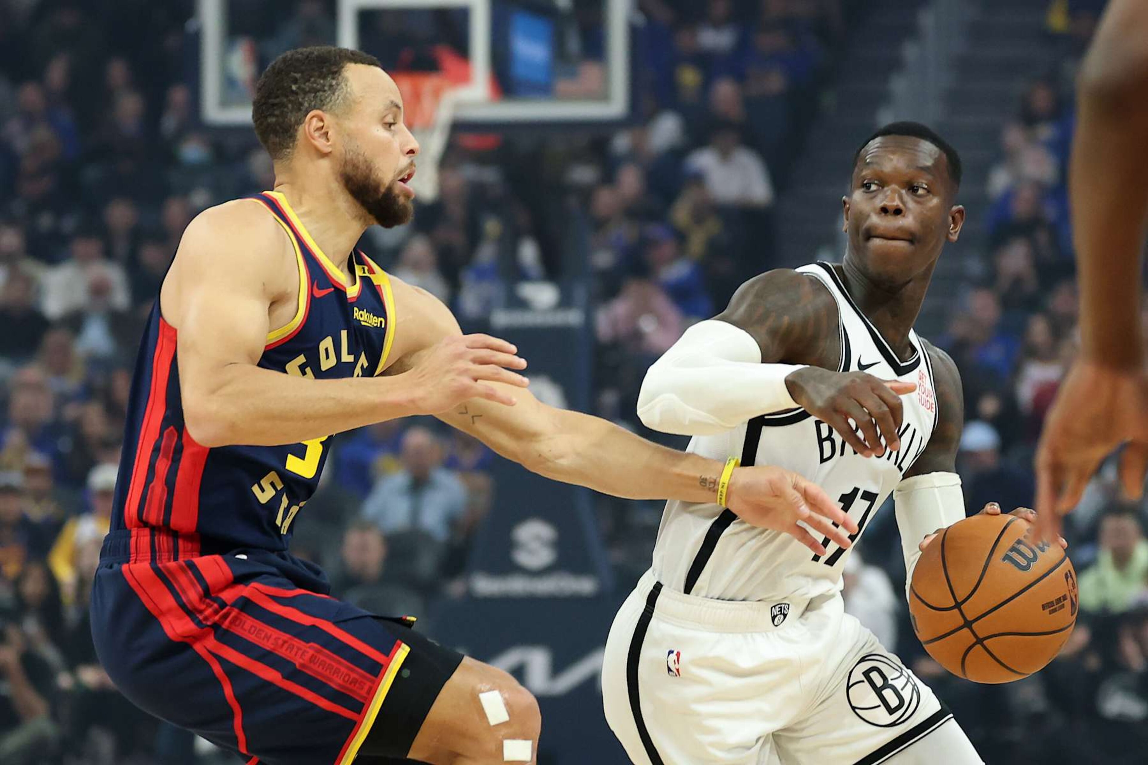 SAN FRANCISCO, CALIFORNIA - NOVEMBER 25: Dennis Schroder #17 of the Brooklyn Nets is guarded by Stephen Curry #30 of the Golden State Warriors in the first half at Chase Center on November 25, 2024 in San Francisco, California. NOTE TO USER: User expressly acknowledges and agrees that, by downloading and/or using this photograph, user is consenting to the terms and conditions of the Getty Images License Agreement.   (Photo by Ezra Shaw/Getty Images)