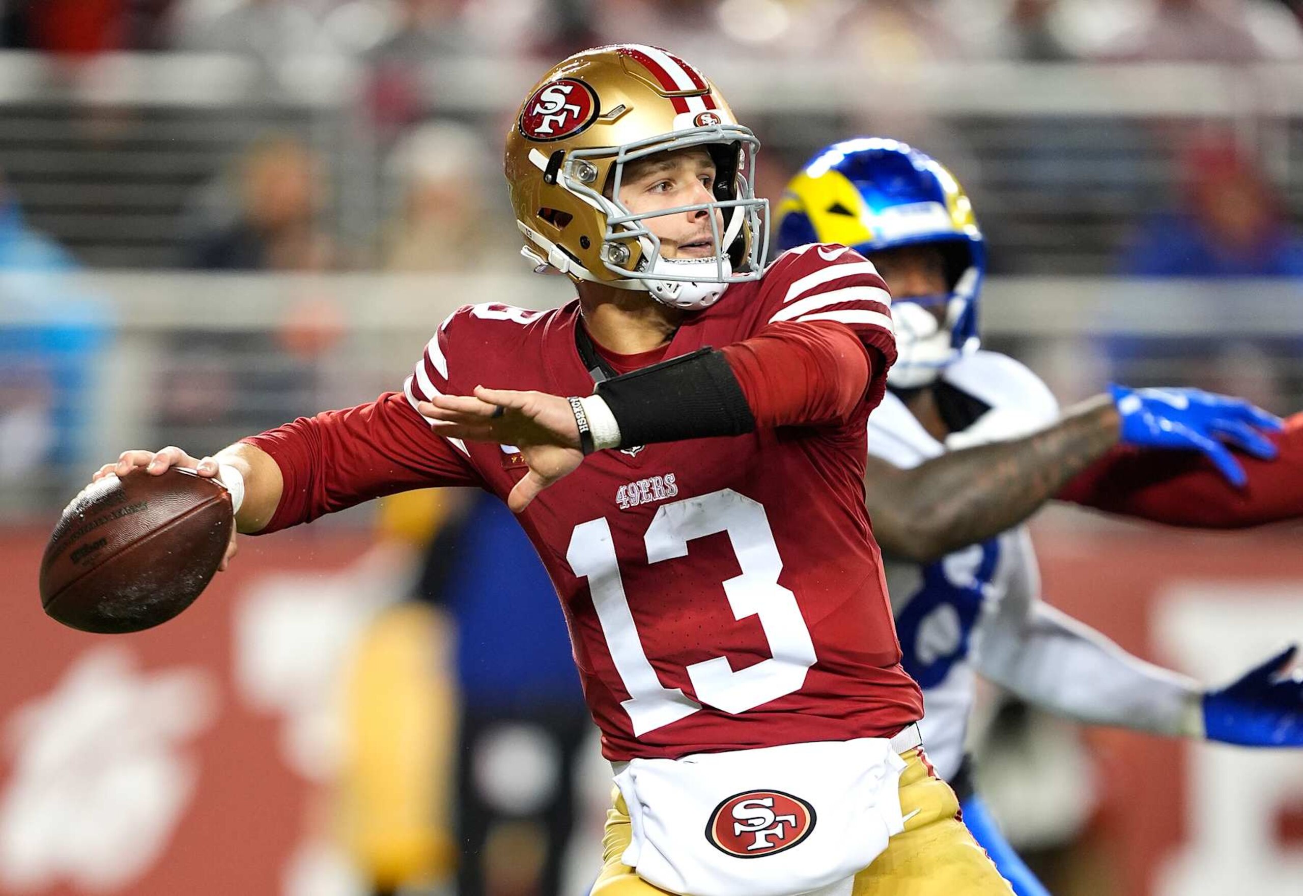 SANTA CLARA, CALIFORNIA - DECEMBER 12: Brock Purdy #13 of the San Francisco 49ers drops back looking to pass against the Los Angeles Rams during the fourth quarter at Levi's Stadium on December 12, 2024 in Santa Clara, California. (Photo by Thearon W. Henderson/Getty Images)