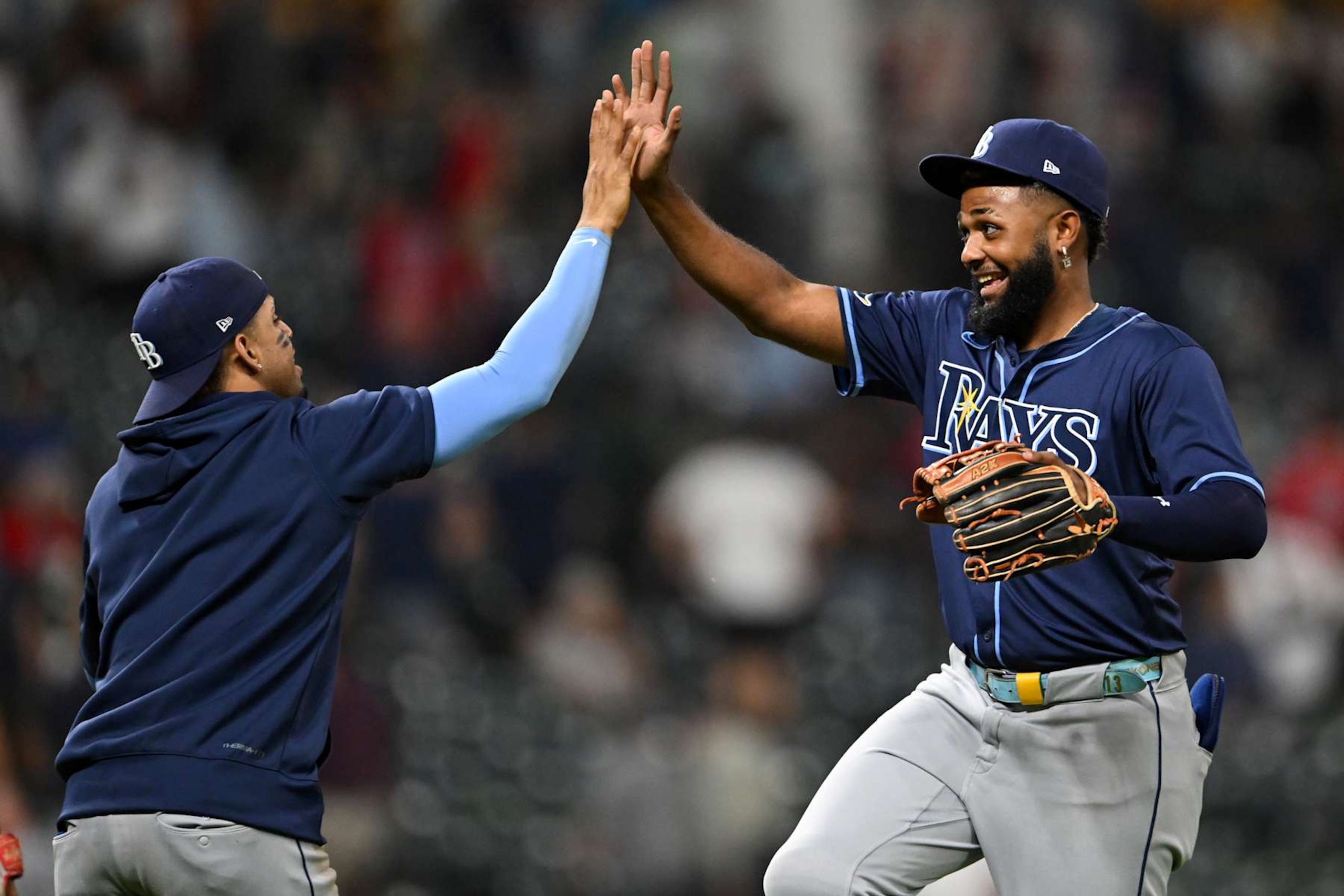 CLEVELAND, OHIO - SEPTEMBER 12: Christopher Morel #24 and Junior Caminero #13 of the Tampa Bay Rays celebrate the team's 5-2 win over the Cleveland Guardians at Progressive Field on September 12, 2024 in Cleveland, Ohio. (Photo by Nick Cammett/Getty Images) CLEVELAND, OHIO - SEPTEMBER 12: Christopher Morel #24 and Junior Caminero #13 of the Tampa Bay Rays celebrate the team's 5-2 win over the Cleveland Guardians at Progressive Field on September 12, 2024 in Cleveland, Ohio. (Photo by Nick Cammett/Getty Images)