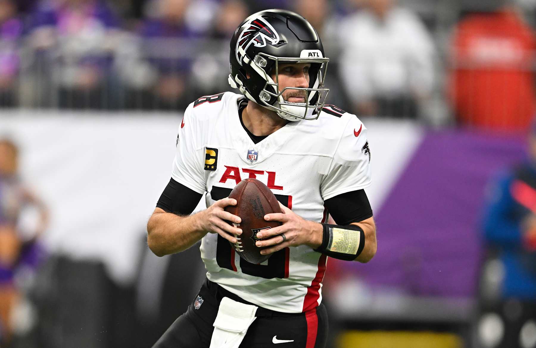 MINNEAPOLIS, MINNESOTA - DECEMBER 8: Quarterback Kirk Cousins #18 of the Atlanta Falcons looks to pass the ball in the first quarter of the game against the Minnesota Vikings at U.S. Bank Stadium on December 8, 2024 in Minneapolis, Minnesota. The Vikings defeated the Falcons 42-21. (Photo by Stephen Maturen/Getty Images)