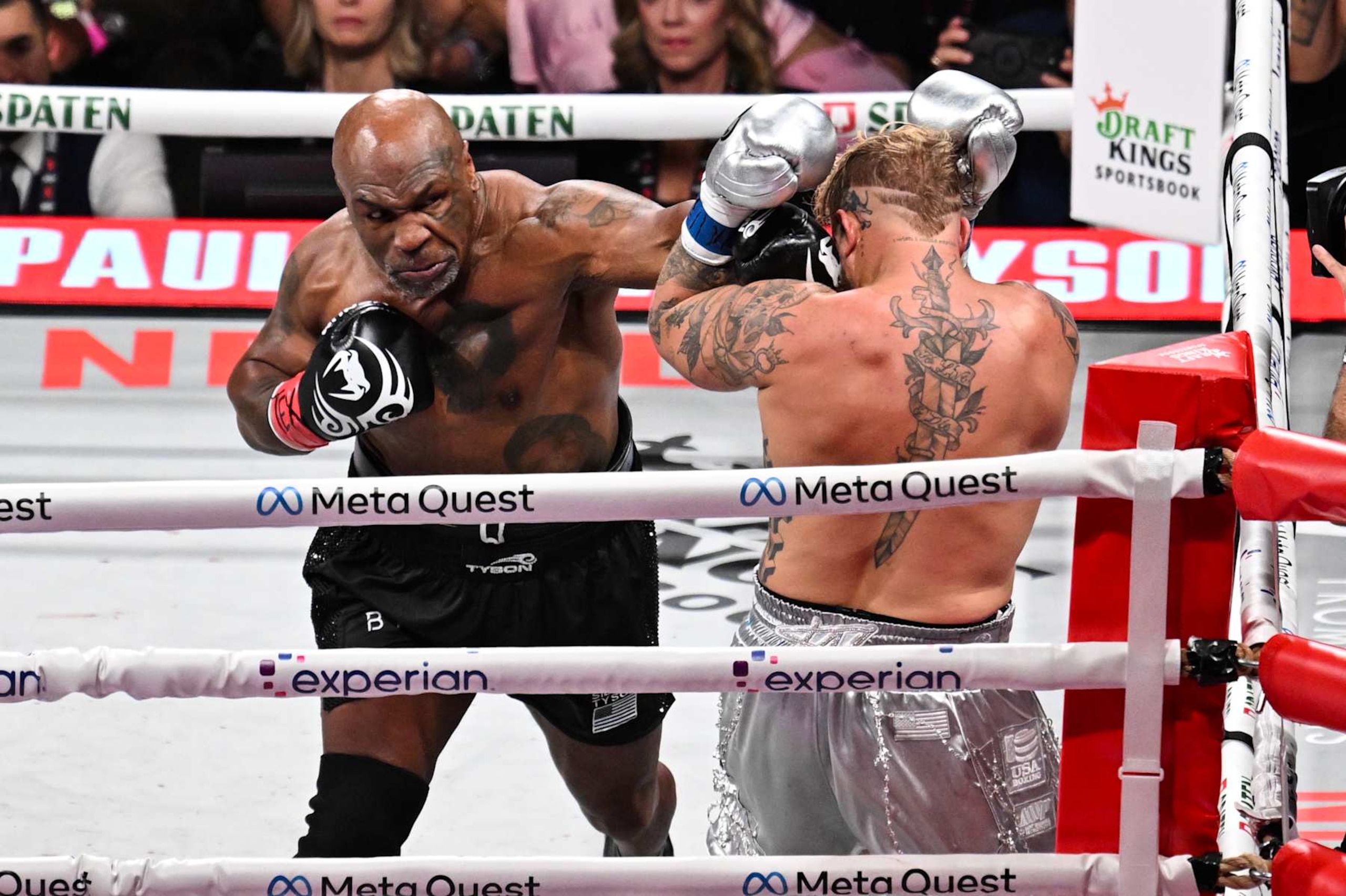 ARLINGTON, TEXAS - NOVEMBER 15: Mike Tyson (in black short) and Jake Paul (in silver short) exchange punches during their heavyweight world titles of the Premiere Boxing Championship on Friday night at AT&T Stadium in Arlington, Texas, United States on November 15, 2024. (Photo by Tayfun Coskun/Anadolu via Getty Images)