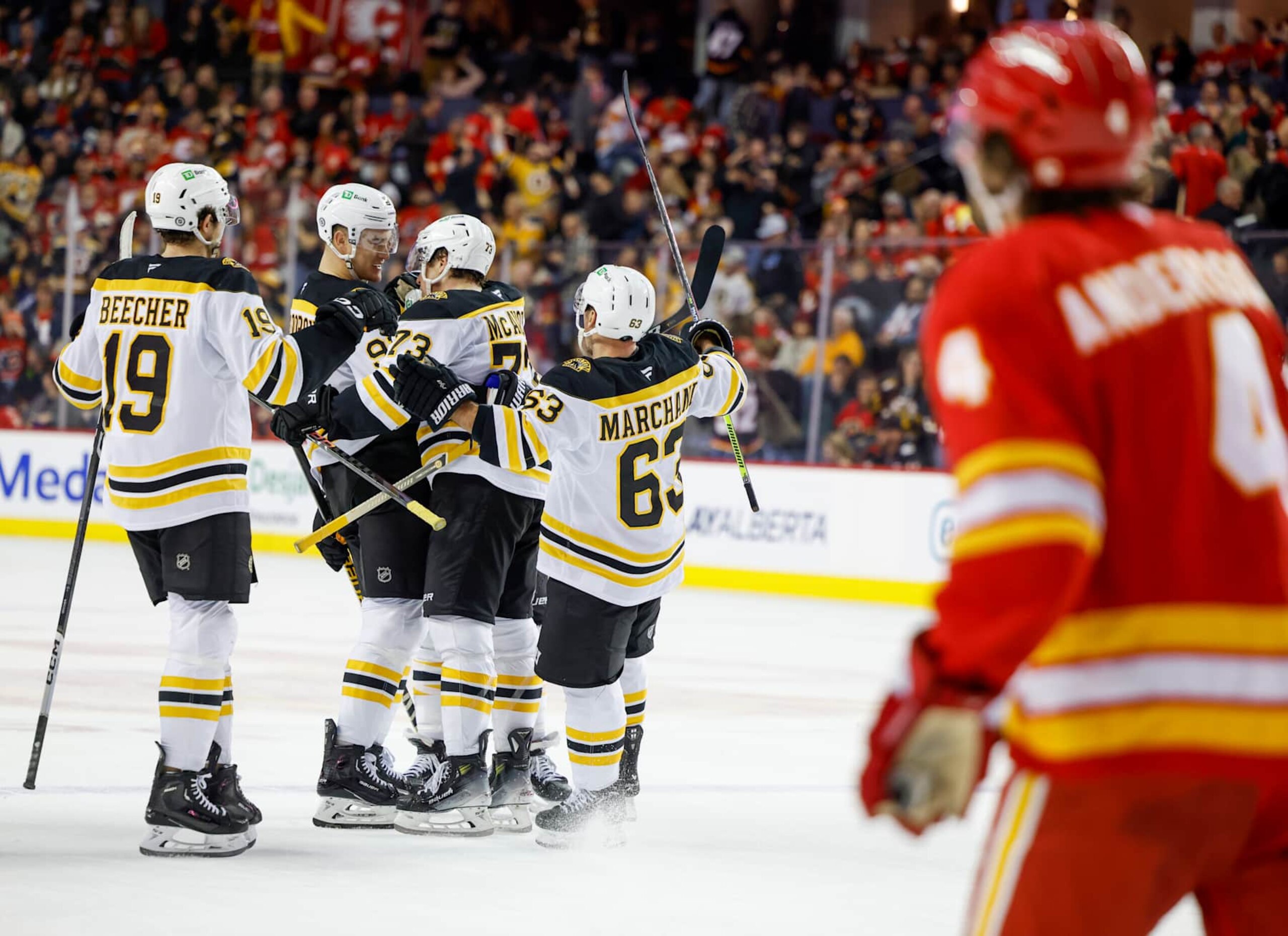 CALGARY, CANADA - DECEMBER 17: Nikita Zadorov #91of the Boston Bruins, Charlie McAvoy #73 of the Boston Bruins, Brad Marchand #63 of the Boston Bruins and John Beecher #19 of the Boston Bruins celebrate their overtime win 4-3 against the Calgary Flames at the Scotiabank Saddledome on December 17, 2024, in Calgary, Alberta, Canada. (Photo by Leah Hennel/Getty Images)