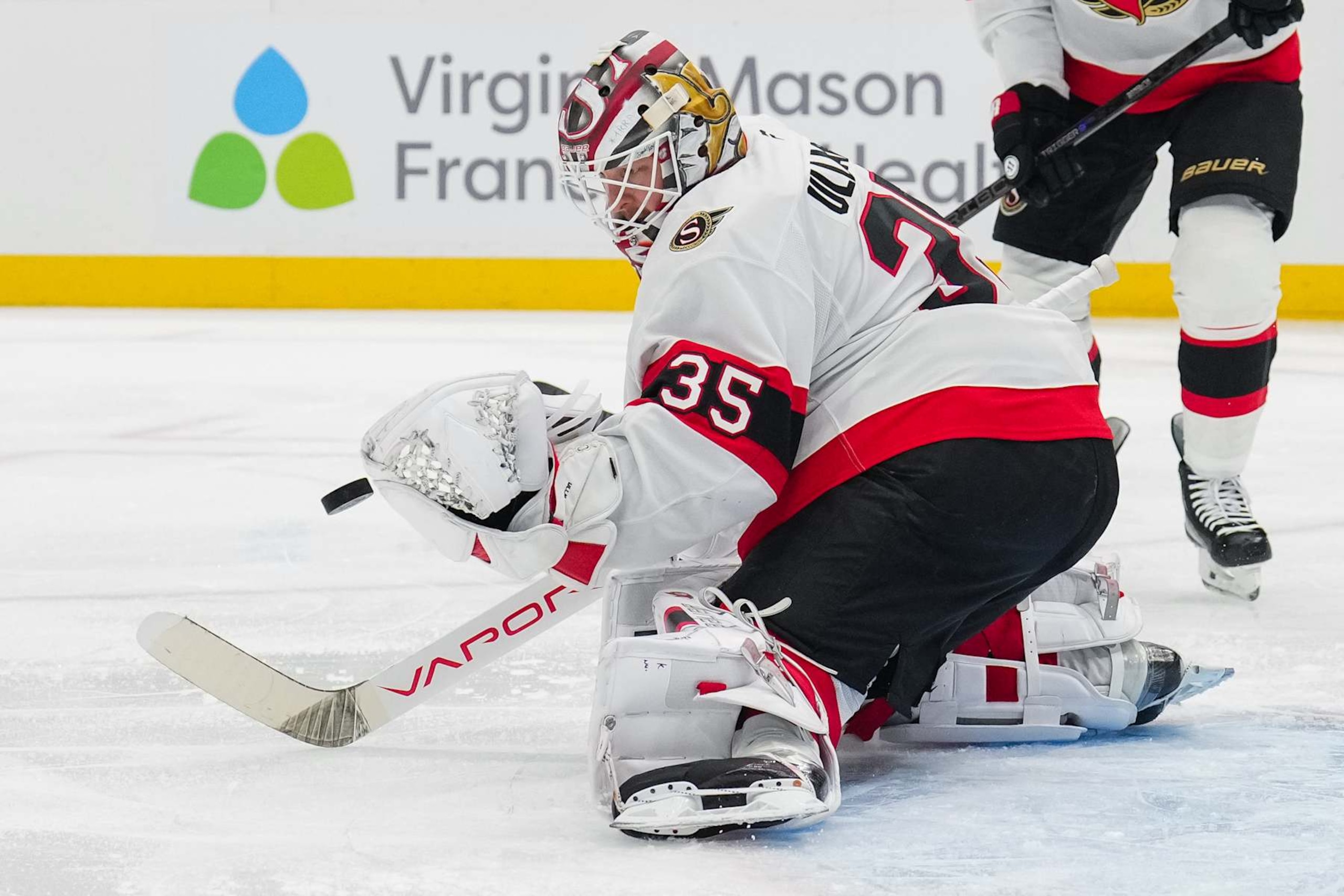 SEATTLE, WASHINGTON - DECEMBER 17: Linus Ullmark #35 of the Ottawa Senators moves to block a shot during the first period of a game against the Seattle Kraken at Climate Pledge Arena on December 17, 2024 in Seattle, Washington. (Photo by Christopher Mast/NHLI via Getty Images)