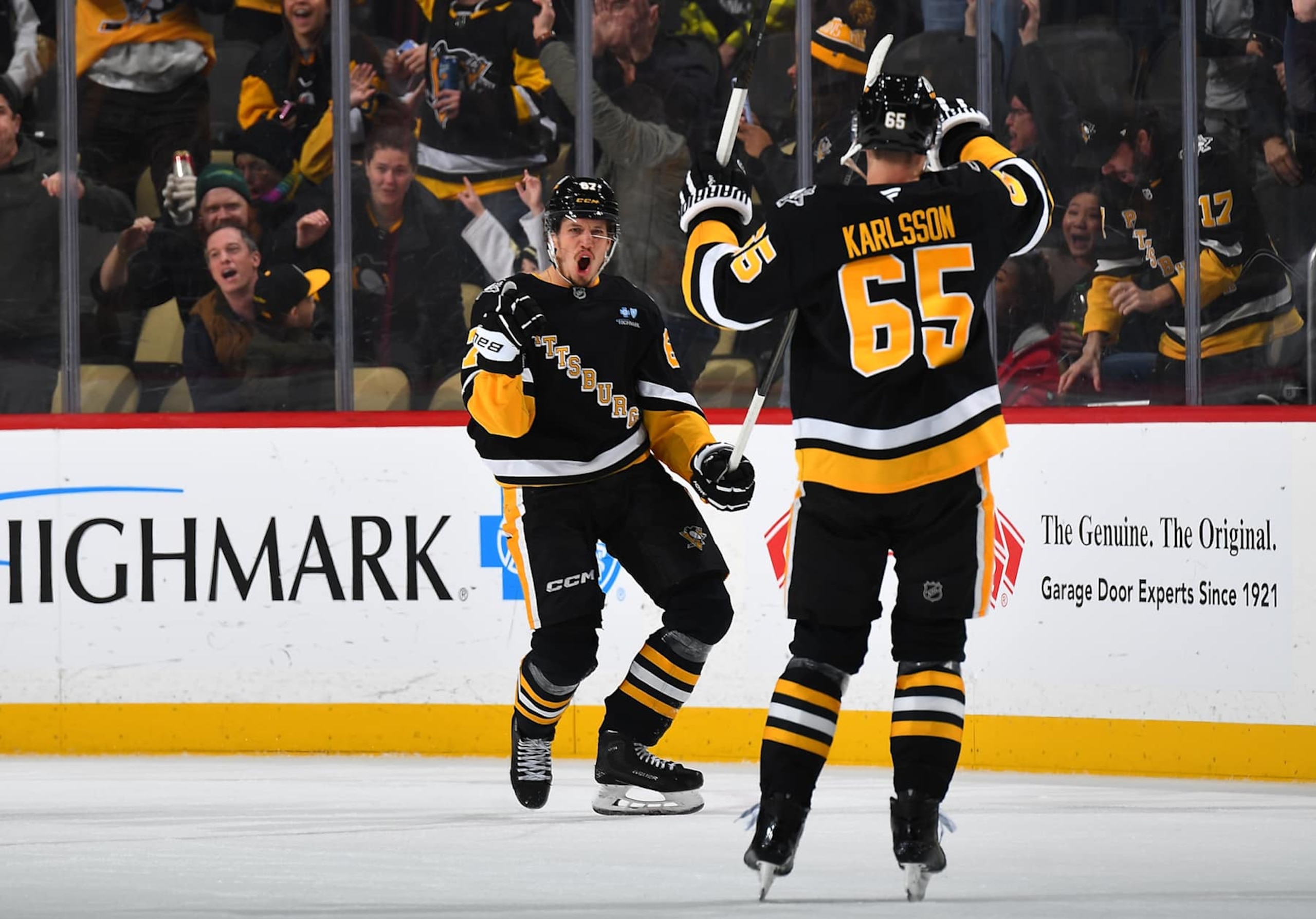 PITTSBURGH, PA - DECEMBER 17:  Rickard Rakell #67 celebrates his overtime goal with Erik Karlsson #65 of the Pittsburgh Penguins against the Los Angeles Kings at PPG PAINTS Arena on December 17, 2024 in Pittsburgh, Pennsylvania. (Photo by Joe Sargent/NHLI via Getty Images)