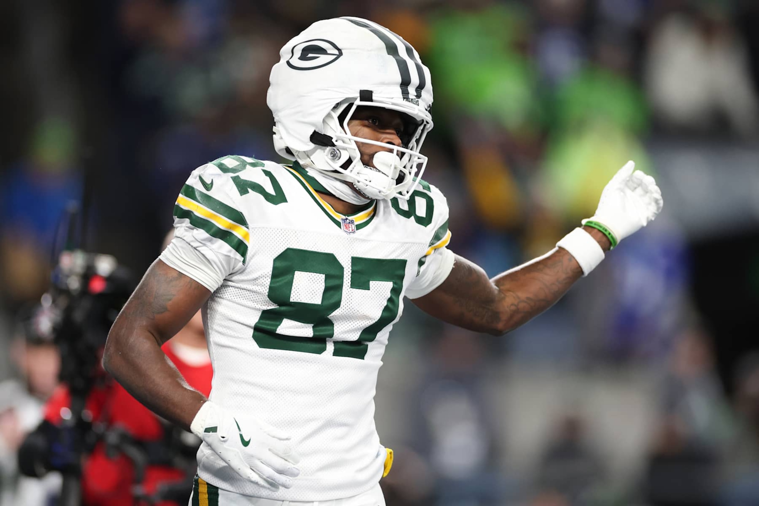 SEATTLE, WASHINGTON - DECEMBER 15: Romeo Doubs #87 of the Green Bay Packers celebrates after scoring a touchdown against the Seattle Seahawks during the fourth quarter of the game at Lumen Field on December 15, 2024 in Seattle, Washington. (Photo by Steph Chambers/Getty Images)