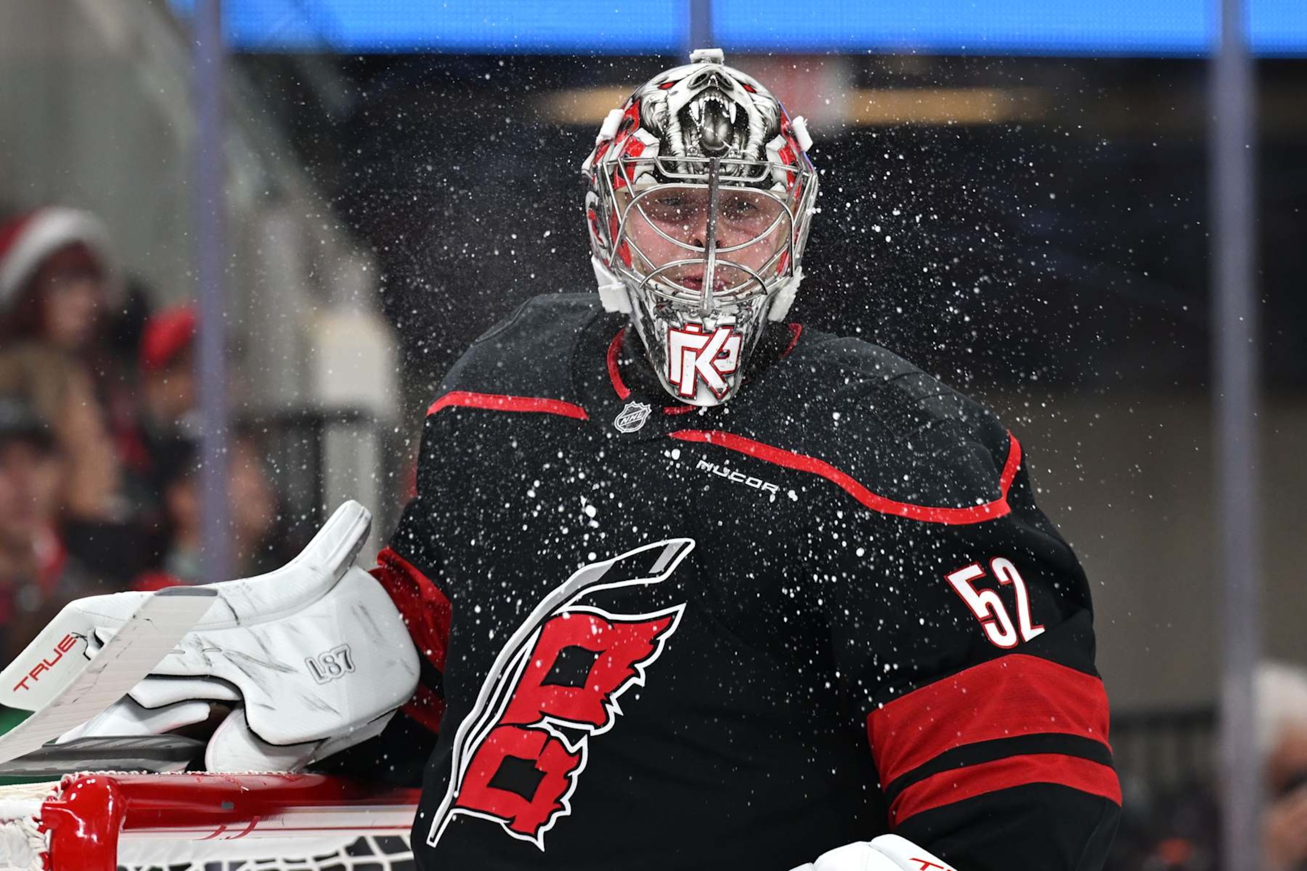 RALEIGH, NC - DECEMBER 17: Carolina Hurricanes goalie Pyotr Kochetkov (52) spits out water in between plays during the NHL game between the New York Islanders and the Carolina Hurricanes on December 17, 2024 at Lenovo Center in Raleigh, North Carolina. (Photo by Katherine Gawlik/Icon Sportswire via Getty Images)