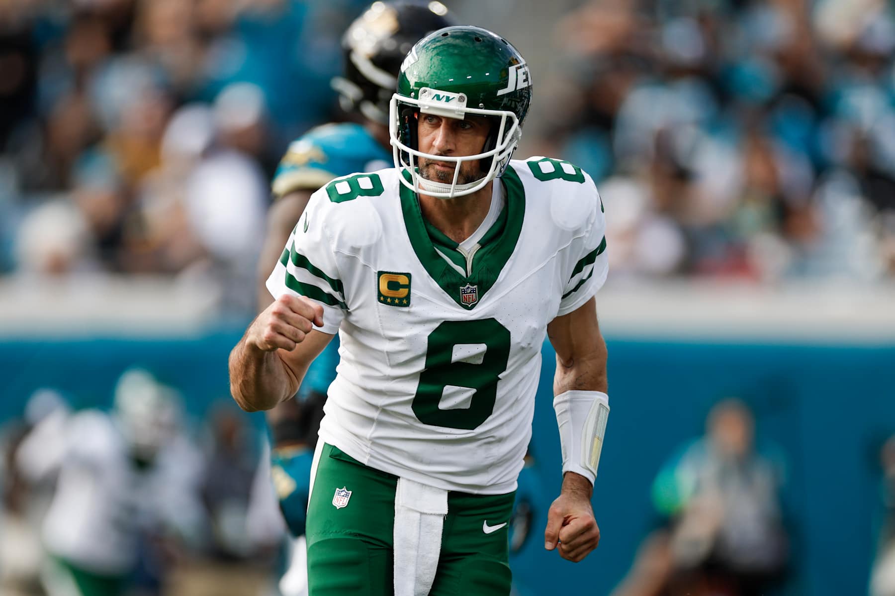 JACKSONVILLE, FL - DECEMBER 15: New York Jets quarterback Aaron Rodgers (8) reacts after throwing a touchdown pass during the game between the Jacksonville Jaguars and the New York Jets on December 15, 2024 at EverBank Stadium in Jacksonville, Fl. (Photo by David Rosenblum/Icon Sportswire via Getty Images)