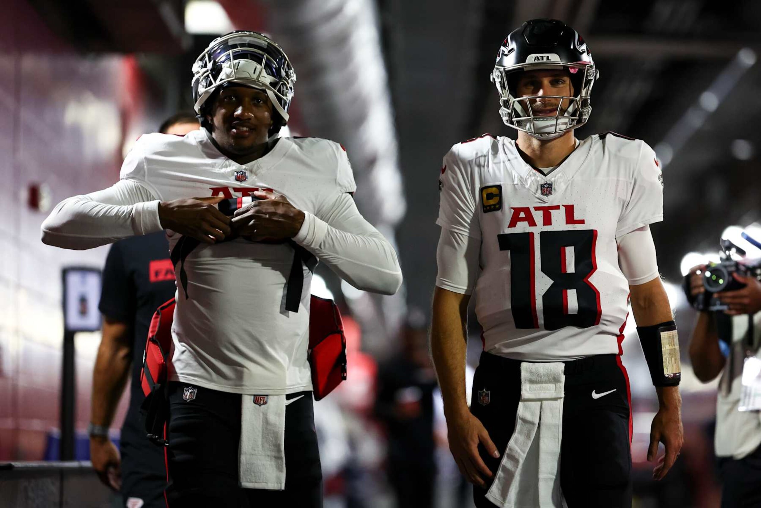 TAMPA, FLORIDA - OCTOBER 27: Michael Penix Jr. #9 and Kirk Cousins #18 of the Atlanta Falcons walk through the tunnel prior to an NFL football game against the Tampa Bay Buccaneers at Raymond James Stadium on October 27, 2024 in Tampa, Florida. (Photo by Kevin Sabitus/Getty Images) TAMPA, FLORIDA - OCTOBER 27: Michael Penix Jr. #9 and Kirk Cousins #18 of the Atlanta Falcons walk through the tunnel prior to an NFL football game against the Tampa Bay Buccaneers at Raymond James Stadium on October 27, 2024 in Tampa, Florida. (Photo by Kevin Sabitus/Getty Images)