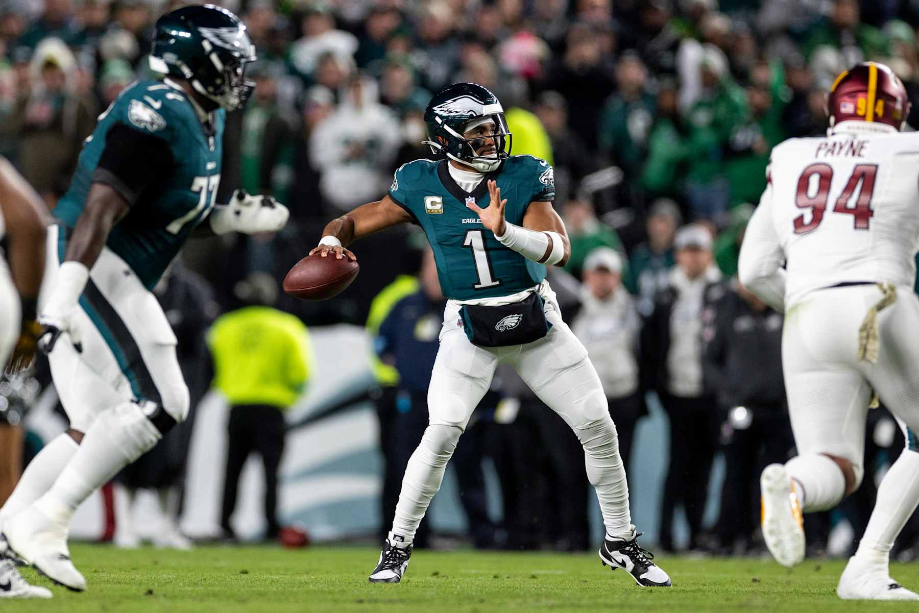 PHILADELPHIA, PENNSYLVANIA - NOVEMBER 14: Jalen Hurts #1 of the Philadelphia Eagles looks to pass during an NFL Football game against the Washington Commanders at Lincoln Financial Field on November 14, 2024 in Philadelphia, Pennsylvania. (Photo by Michael Owens/Getty Images)
